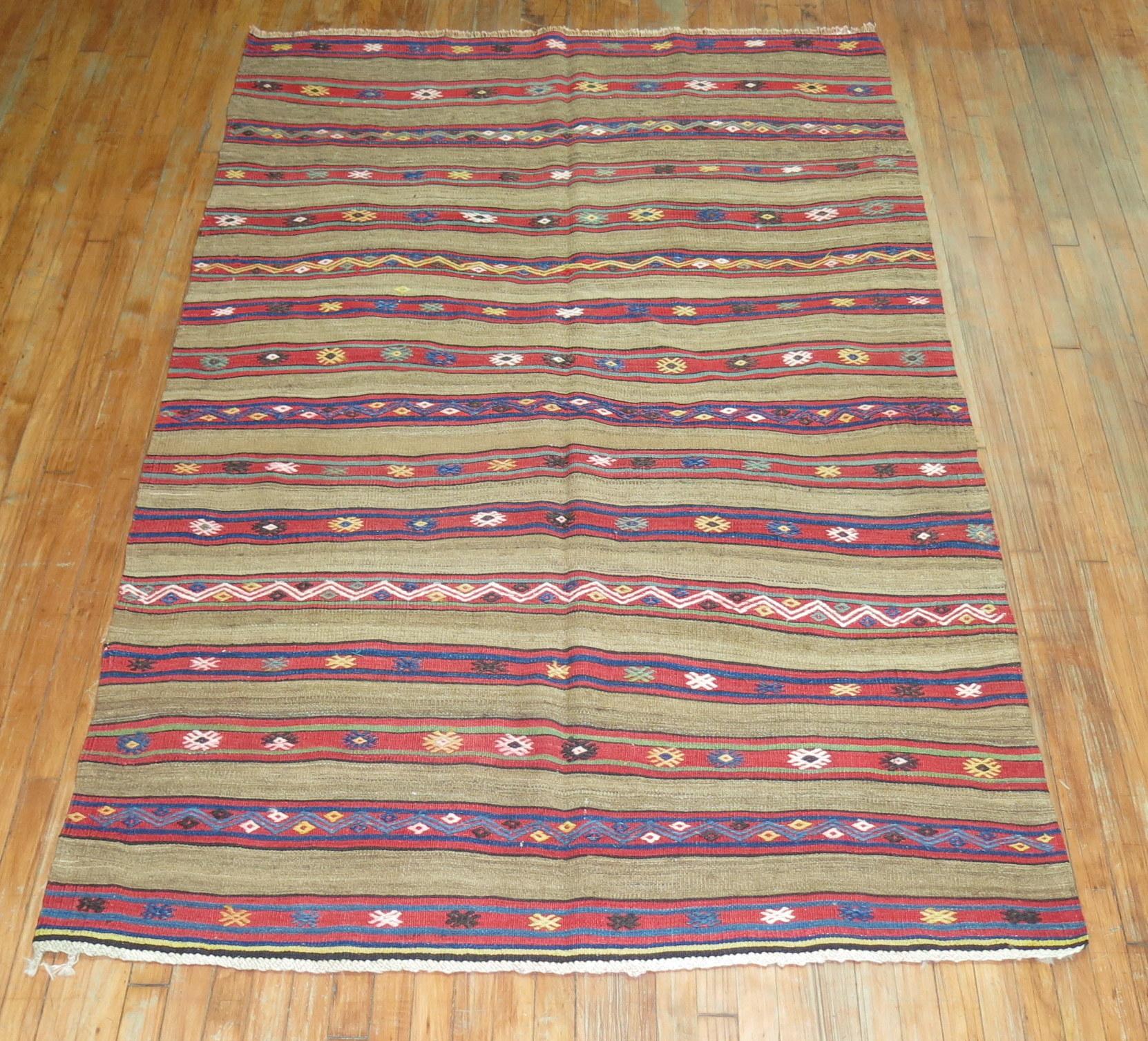 Turkish Kilim from the 2nd quarter of the 20th century with a rustic-like pattern

Measures: 5' x 7'9''.