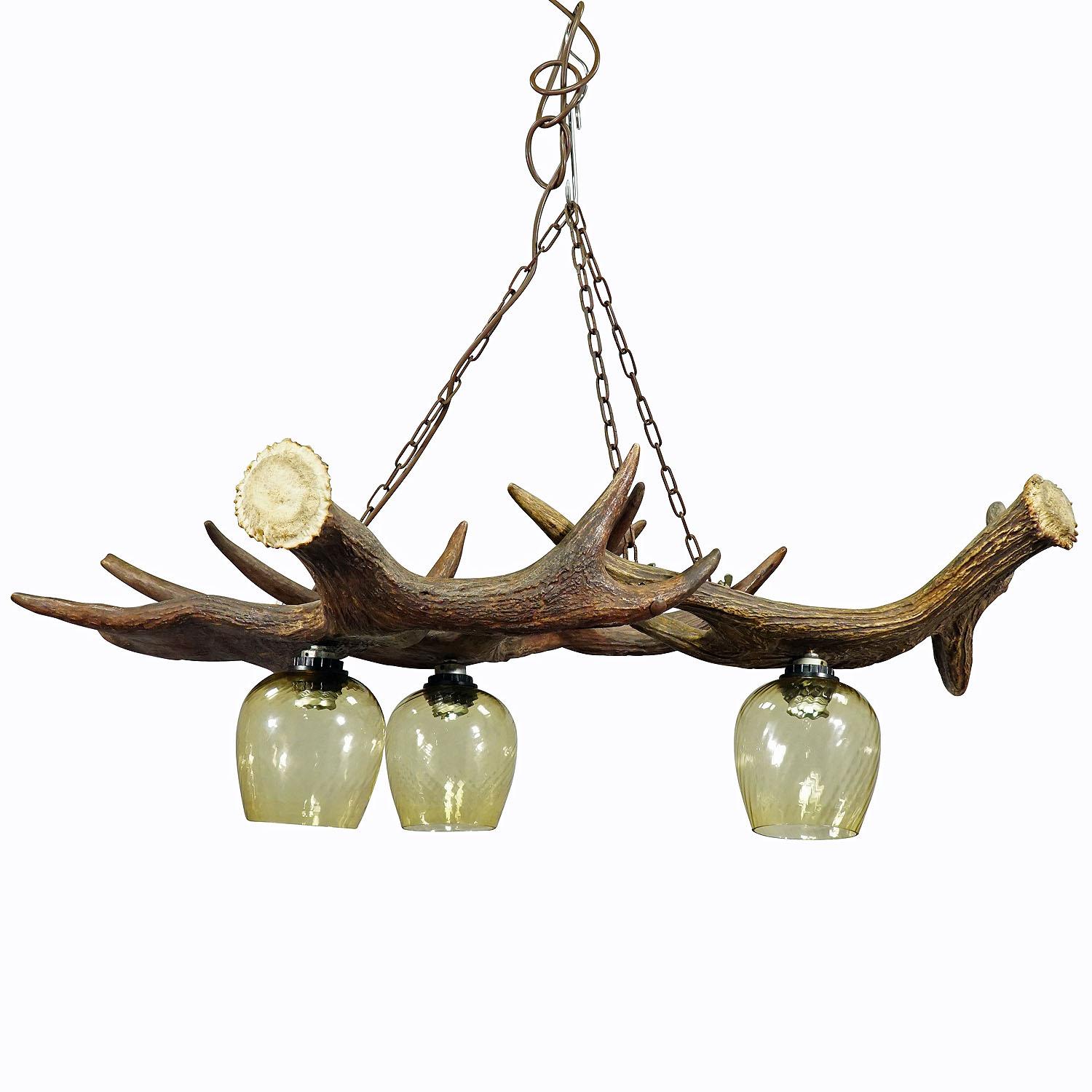 Rustic antler lamp with elk antlers

A large antler chandelier made of three joined elk antlers. The lamp comes with 3 spouts and vintage glass shades. Manufactured in Germany ca. 1960.

Antler furniture have been one of the popular novelties of the