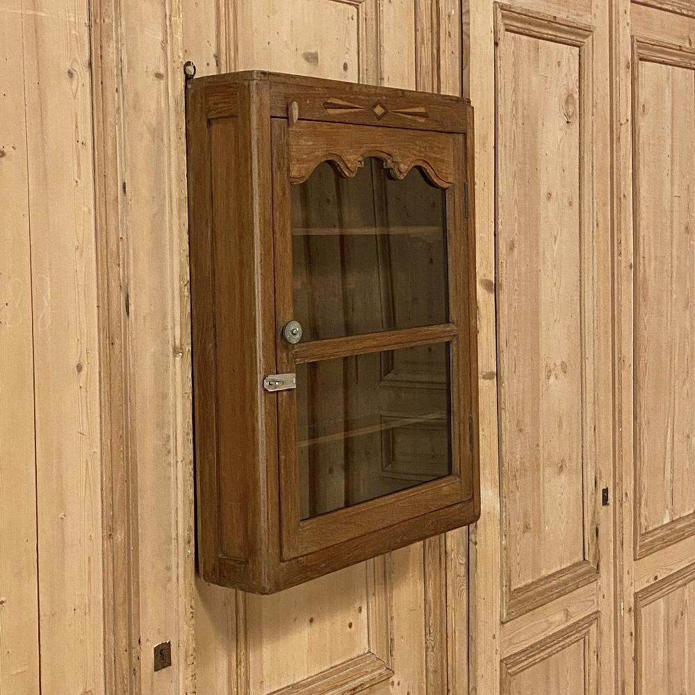 Rustic Art Deco period Swedish wall cabinet represents a charm that is undeniable! The crown features an inlay of satinwood and walnut with a pattern that became popular during the early years of the Art Deco movement. The natural look of the