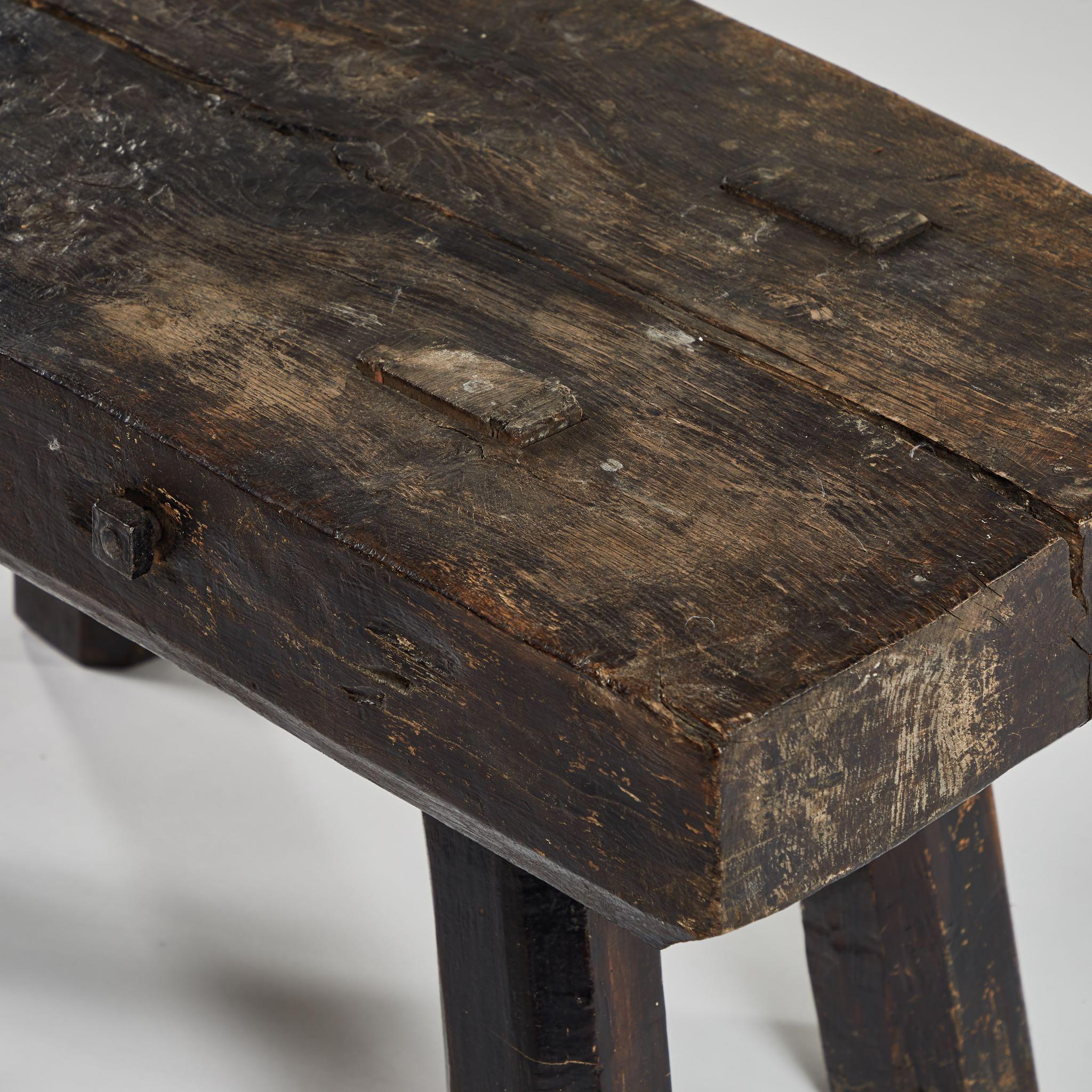 A rustic bench or coffee table, originating in England, circa 1880.
