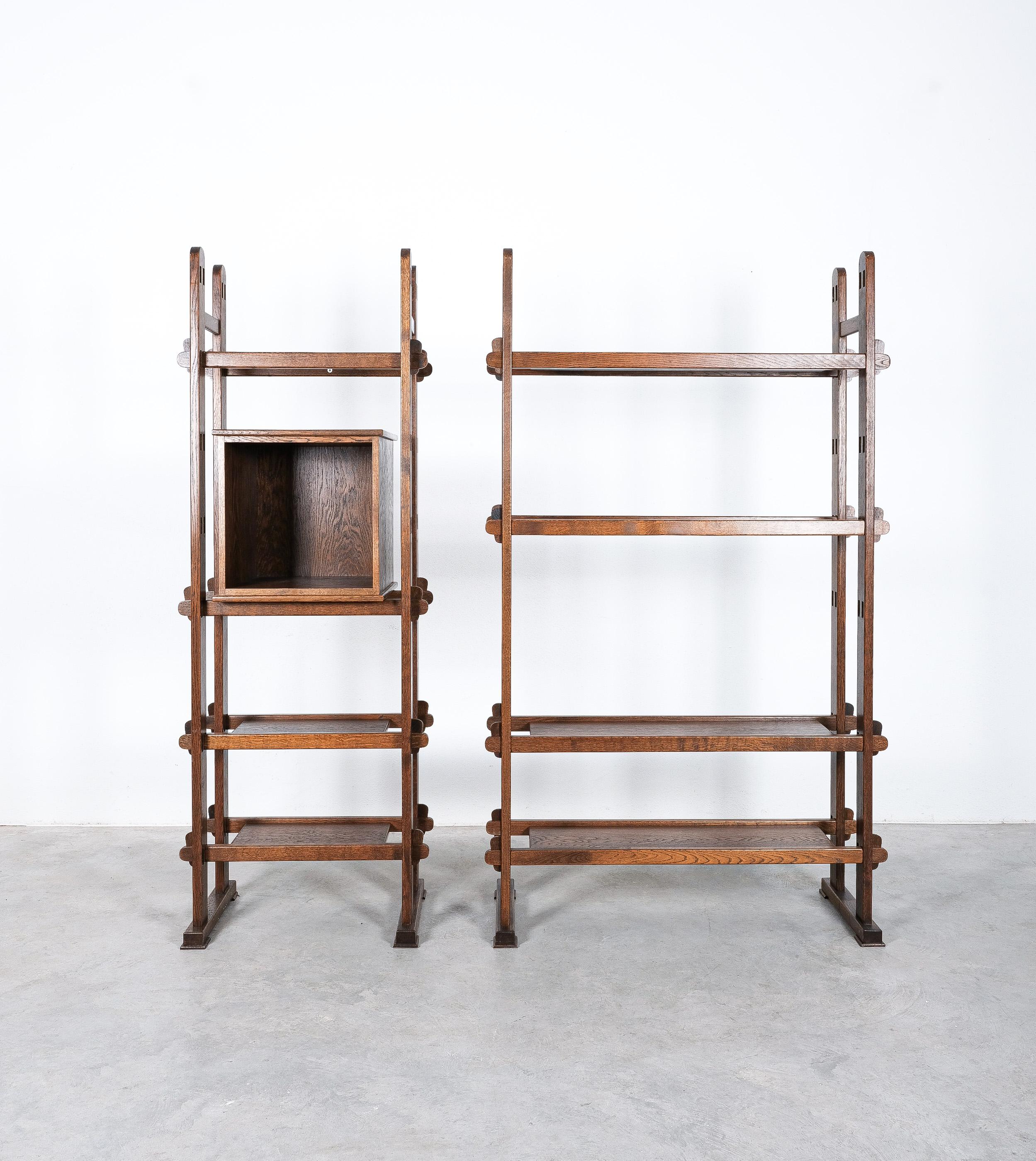 Unique shelf system or bookcase from France, midcentury.

This is an ingenious never seen before self-bearing plug-in shelf-system made from solid oak (except for the box which was later added to the ensemble.)
It's so perfectly handmade that it