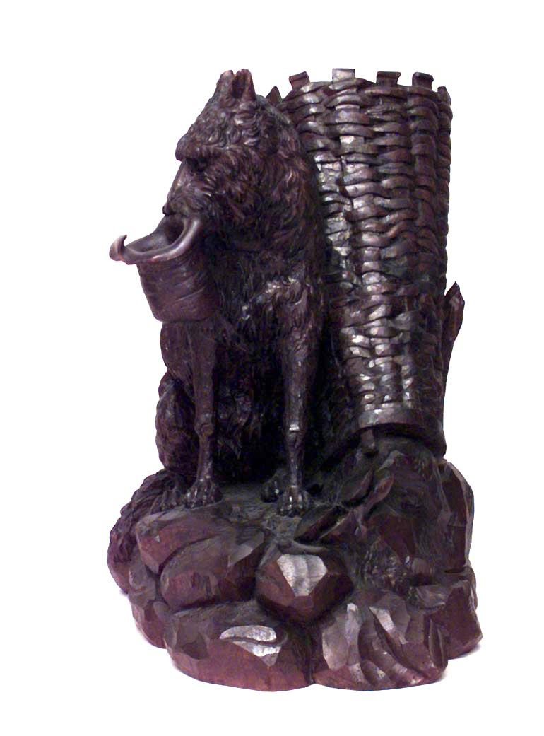 Rustic Black Forest (19th Century) carved walnut figure centerpiece of seated dog holding hat in mouth and basket on back.
