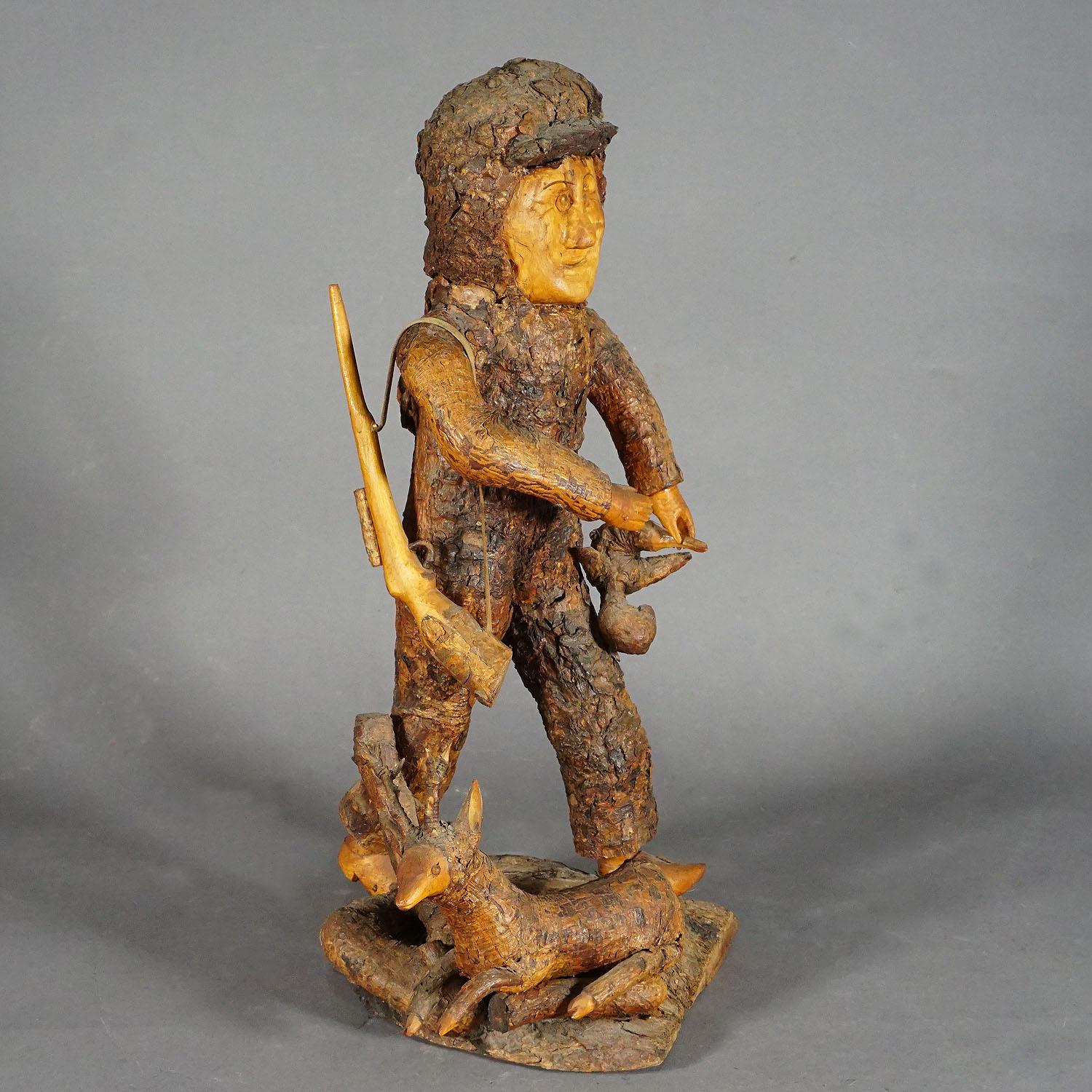 Rustic Black Forest Root Wood Hunter ca. 1920

A rustic wooden hunter statue with deer. It was carved out of a piece of root wood. Germany, Black Forest, circa 1920

Measures: 
Width 9.84