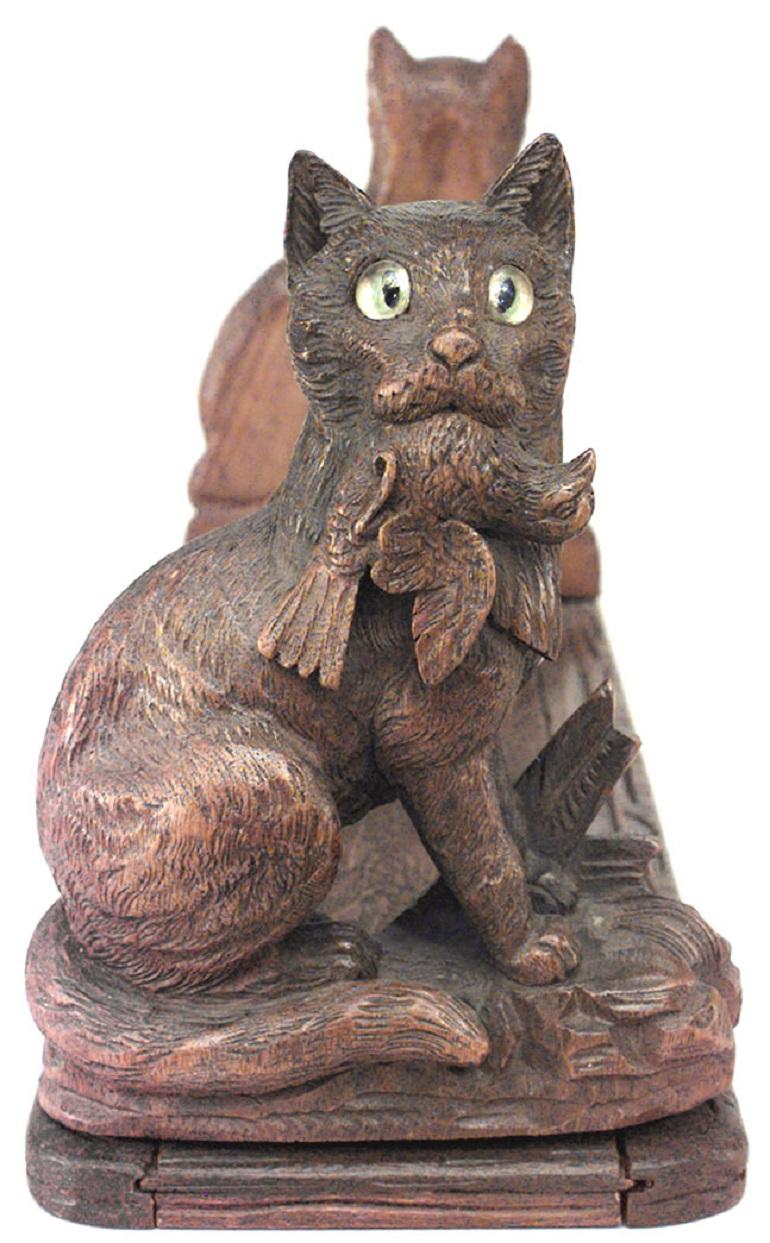 Rustic Black Forest (19th Century) carved walnut adjustable bookends with cat figures.
