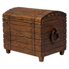 Rustic Black Forest Wood Trunk with Hand Carved Exterior and Ring Handles Rustic Black Forest Wood Trunk with Hand Carved Exterior and Ring Handles