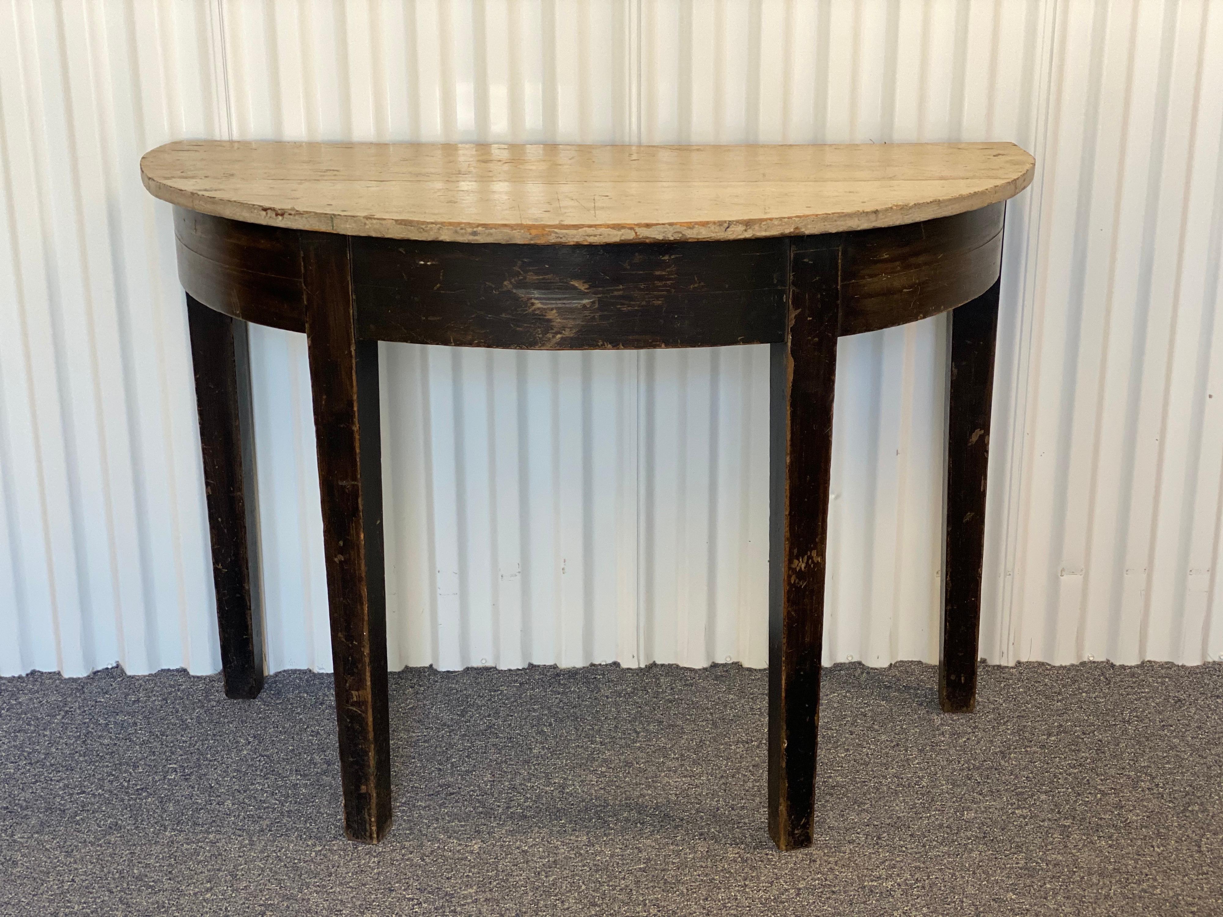 Rustic black painted demilune with creamy/grey top.
Nice worn patina, structurally sound.