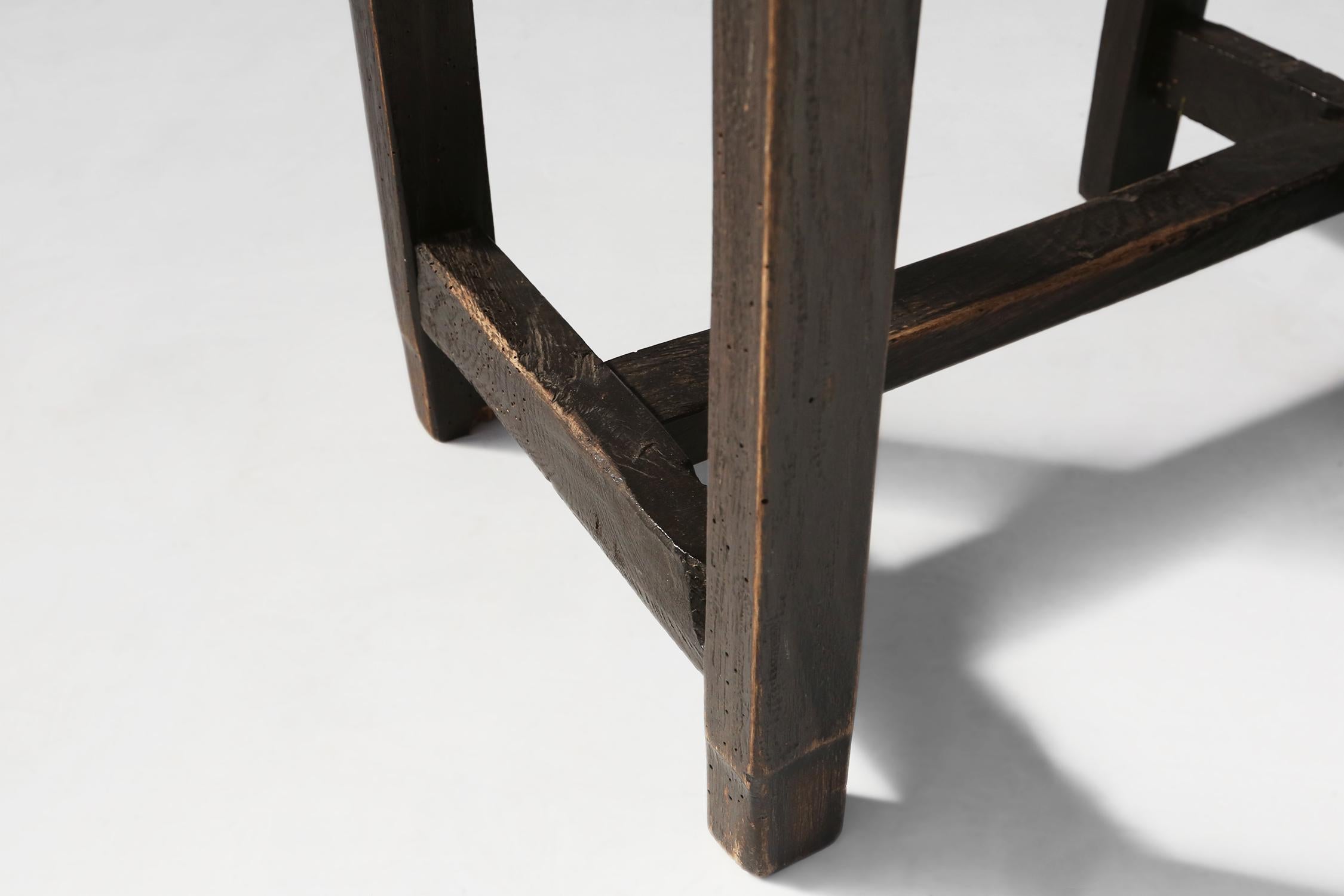 Rustic Black Wooden Stool, circa 1920 For Sale 1