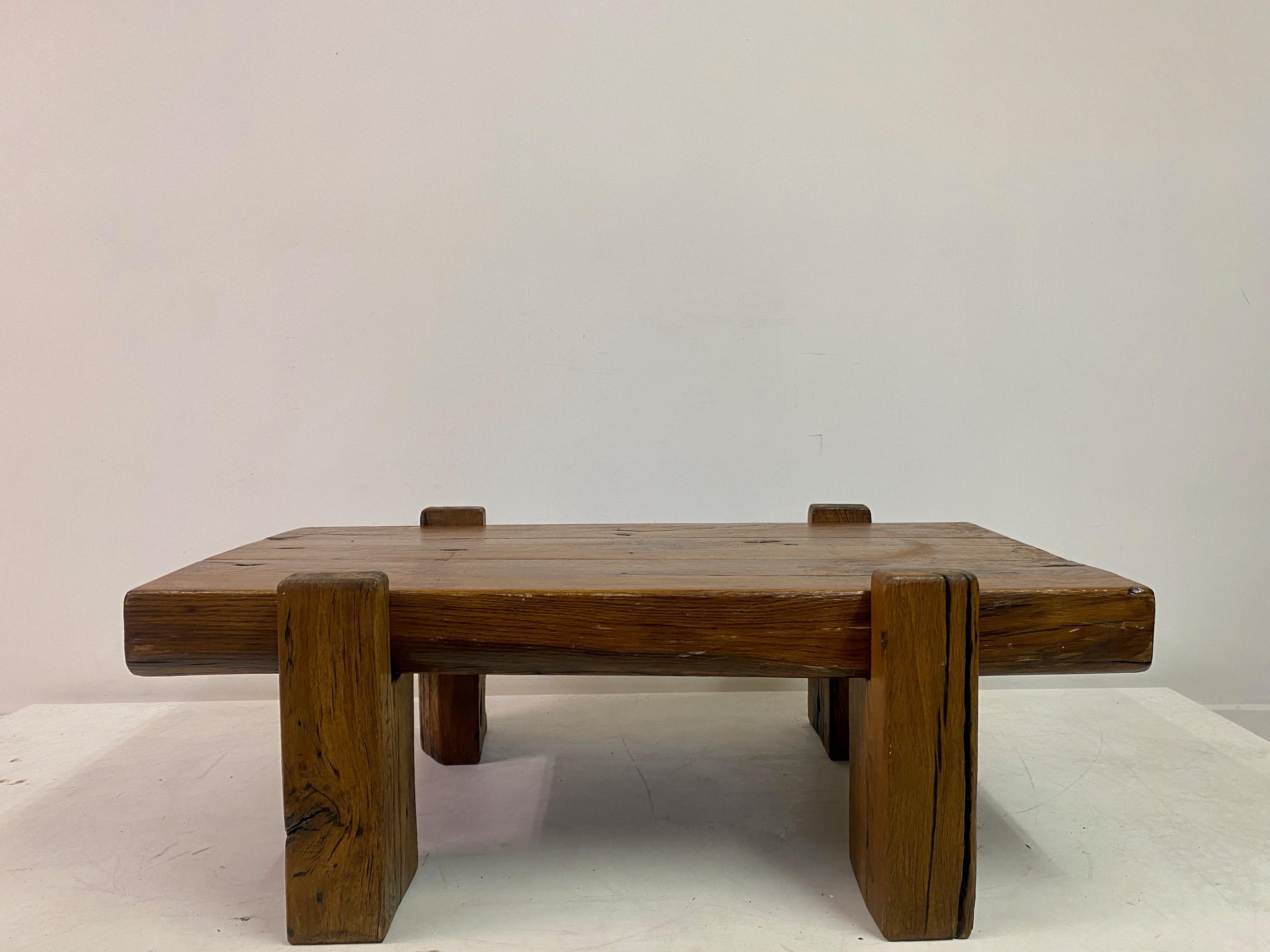 Coffee table

Rustic 

Handmade from reclaimed wood

Four rectangular legs with cut outs to support the top

Heavy three beam top

France 