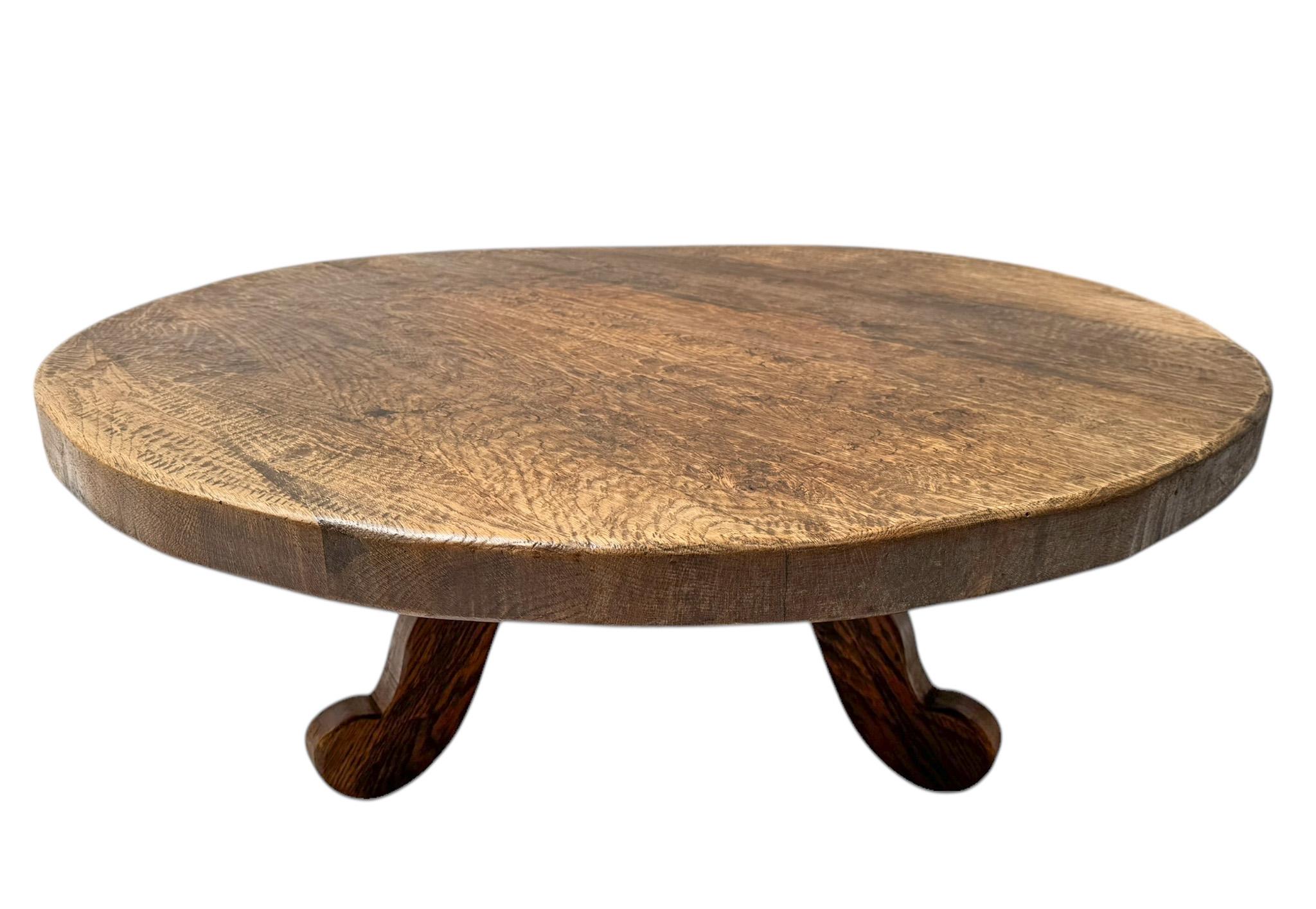 Stunning and elegant Rustic Brutalist Wabi Sabi round coffee table.Striking Dutch design from the 1970s.Solid oak three-legged base with original solid patinated oak round top.This wonderful Rustic Brutalist Wabi Sabi round coffee table is in good