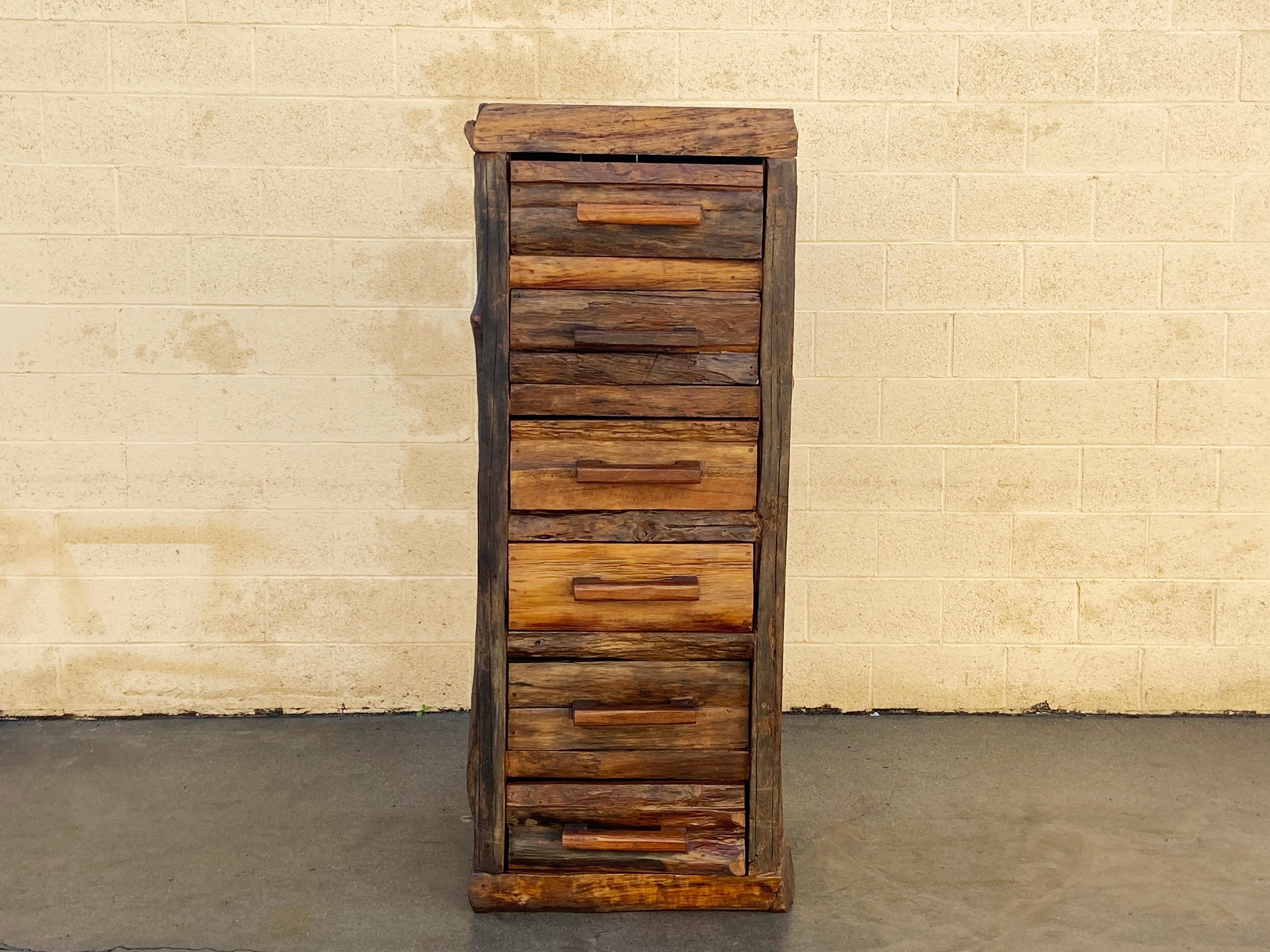 Handcrafted and quality constructed six drawer log chest. This large, vintage piece is made from heavy logs, possibly aspen, with characteristic gnarls, knots and burls. Oversized handle pulls on each drawer make this piece especially memorable. One