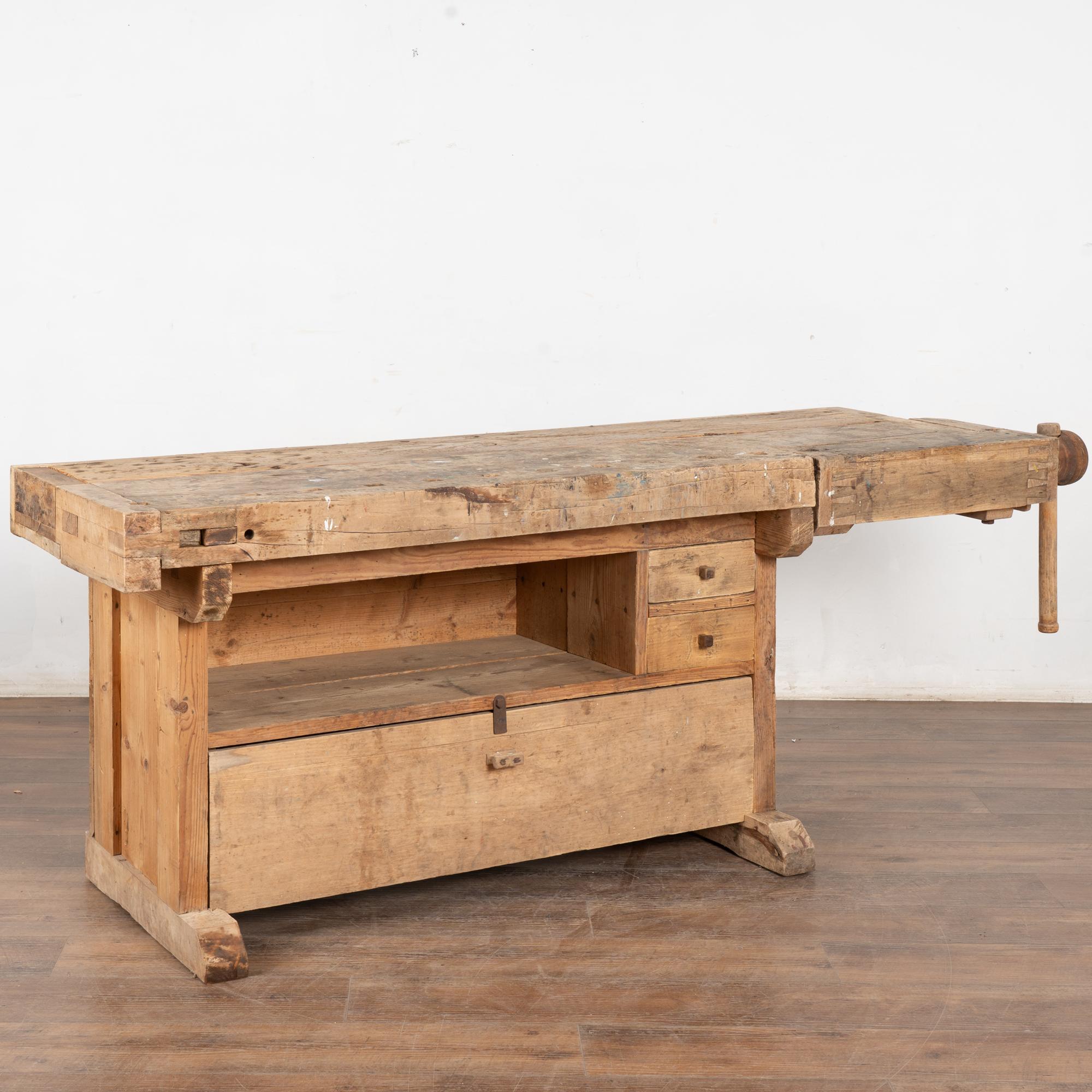 It is the years of constant use revealed in every deep gouge, ding, and scratch that enrich the character of this carpenters' workbench from Denmark.
Unique to this worktable is the lower shelf, two drawers and enclosed storage area.
It has one vice