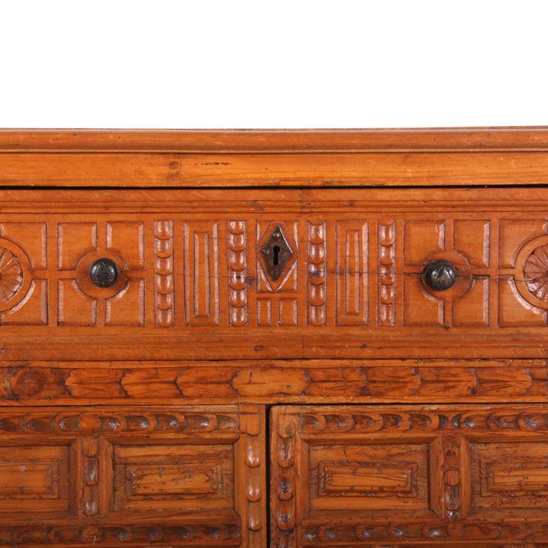 A highly-carved, rustic Italian, pine-and-fruitwood cabinet or buffet, with detailed panelled doors and side panels. The piece has a large, single top drawer over two-door lower cabinet storage, circa 1880. From the Villa la Pausa.




 