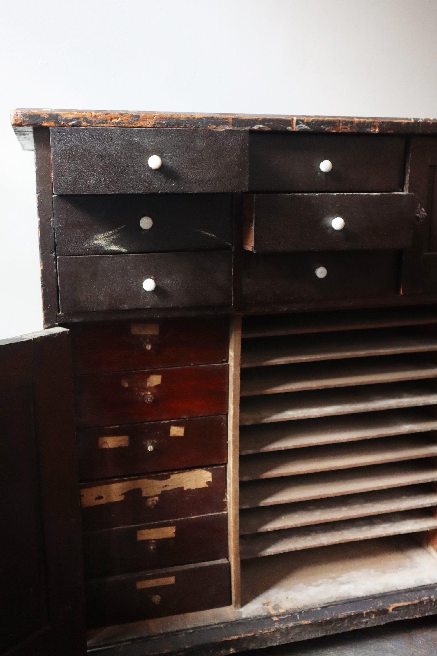 Reclaimed wooden storage chest with drawers and filing system.

