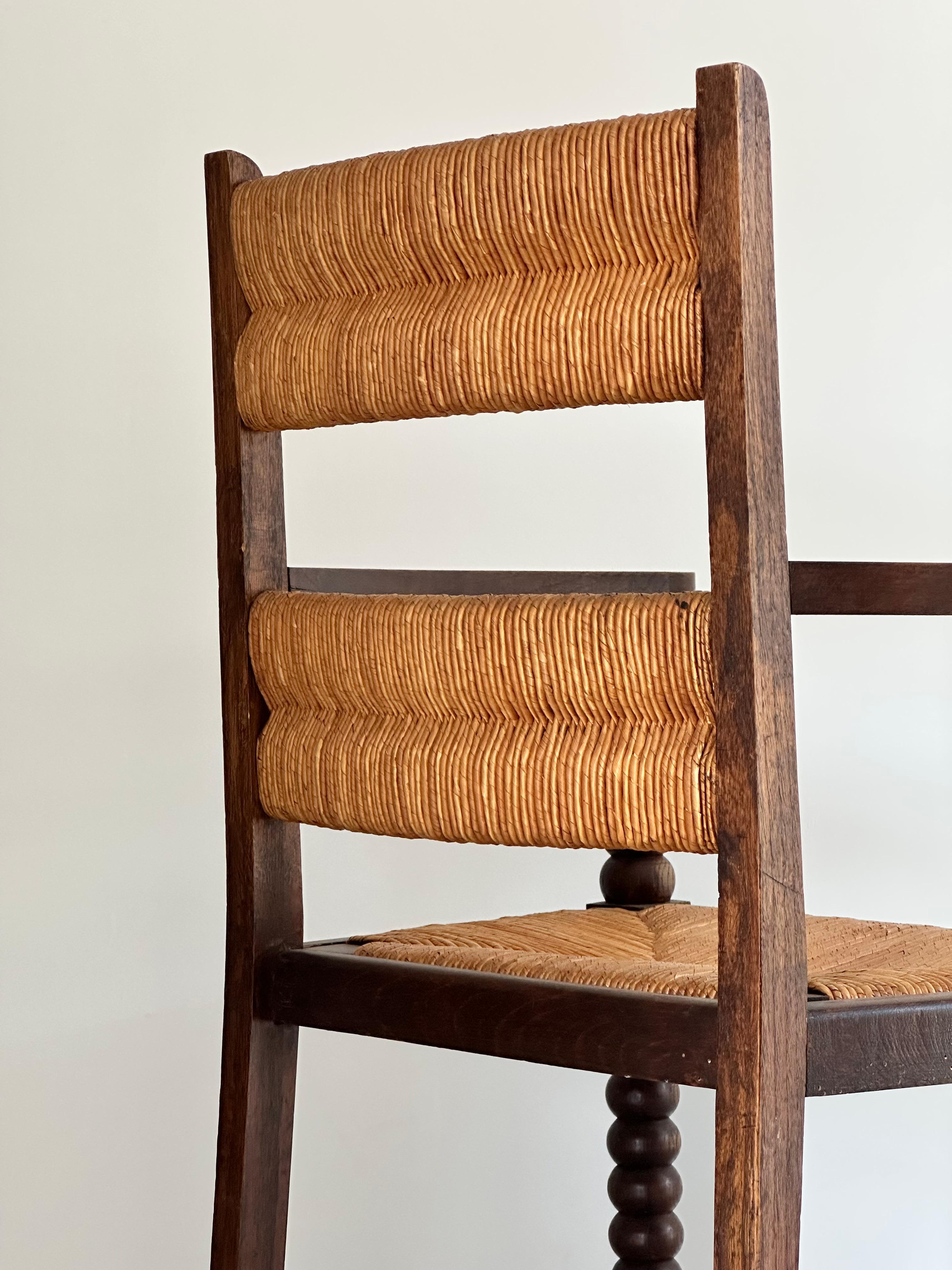 Rustic chic armchair, stained oak, straw, Charles Dudouyt style, France 1950s For Sale 4