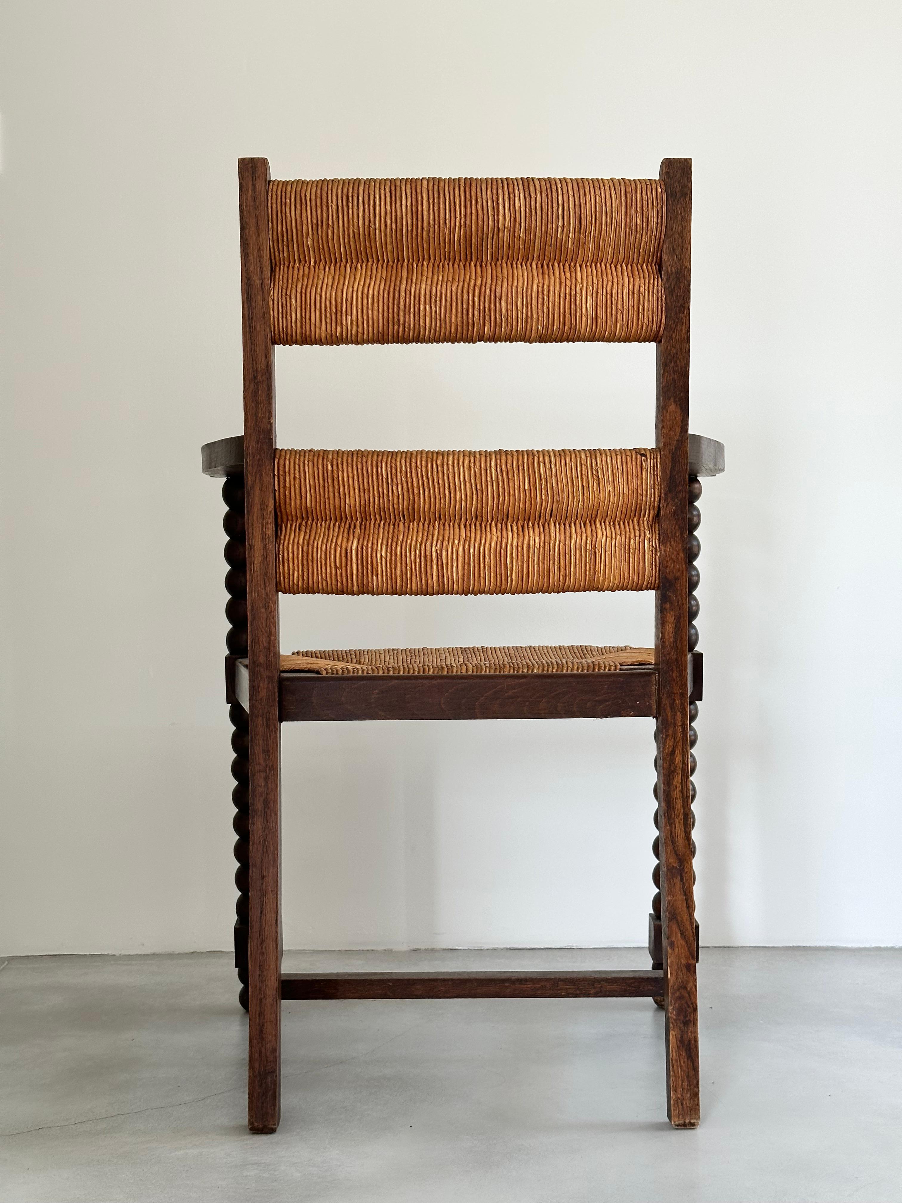 Rustic chic armchair, stained oak, straw, Charles Dudouyt style, France 1950s For Sale 5