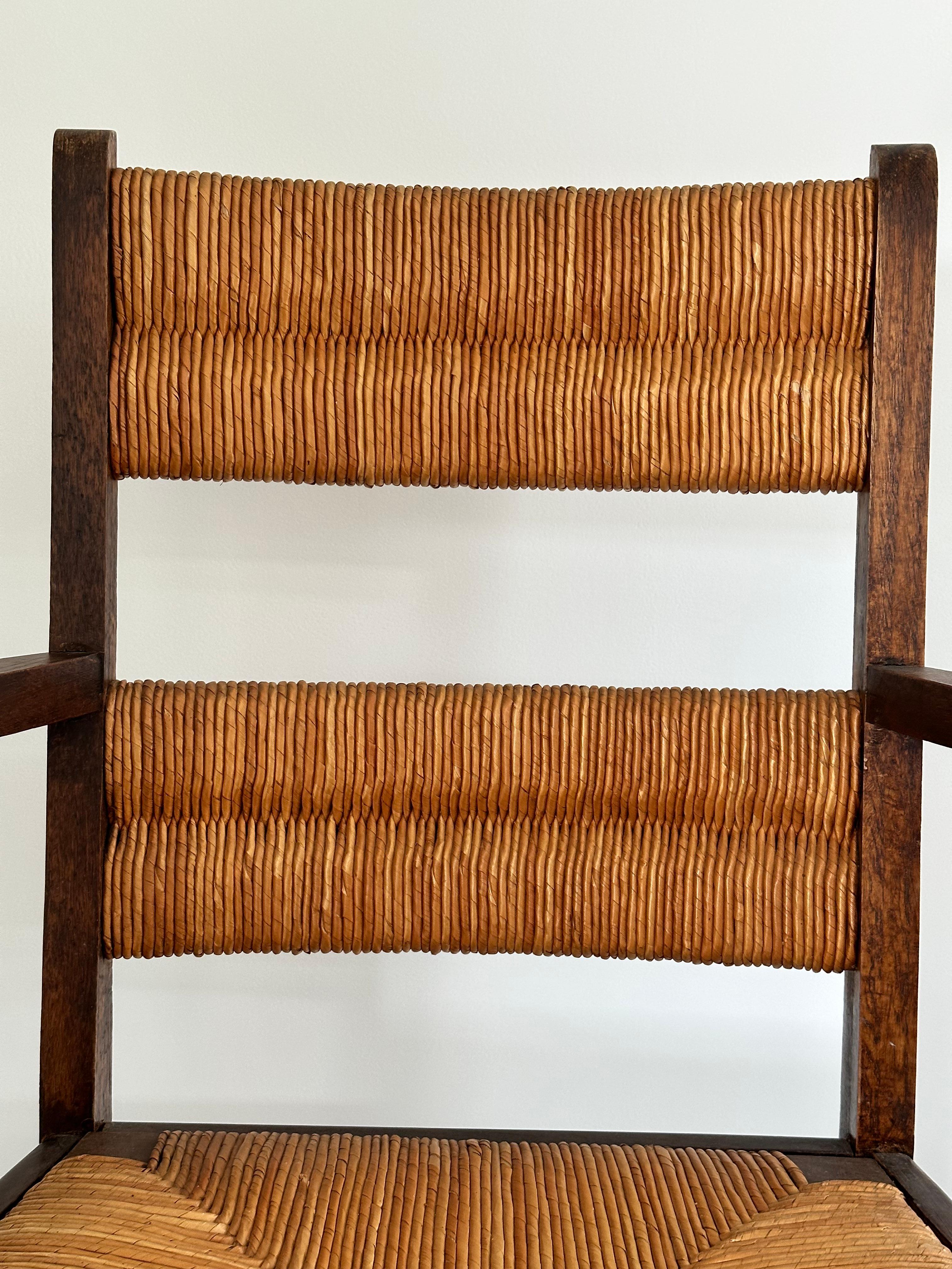 Straw Rustic chic armchair, stained oak, straw, Charles Dudouyt style, France 1950s For Sale