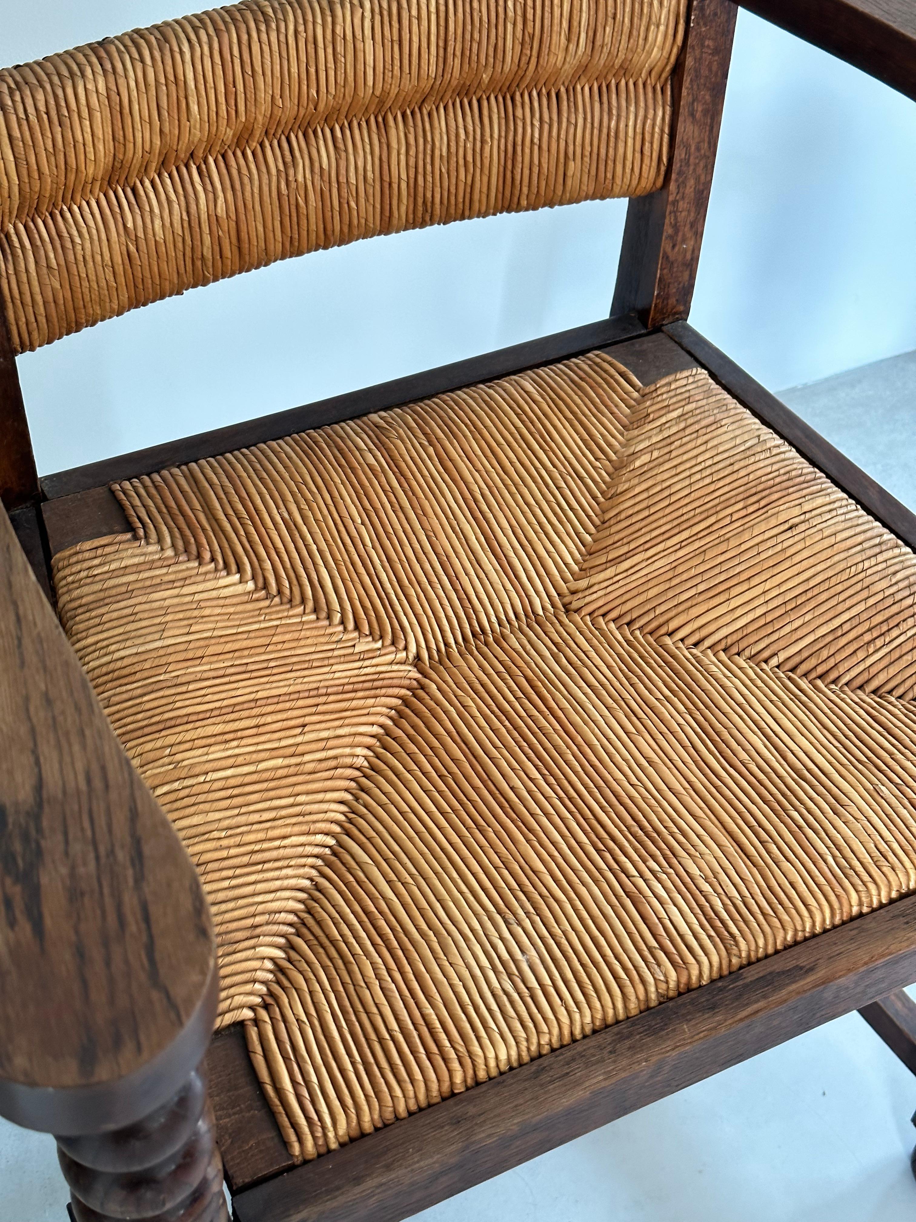 Rustic chic armchair, stained oak, straw, Charles Dudouyt style, France 1950s For Sale 1
