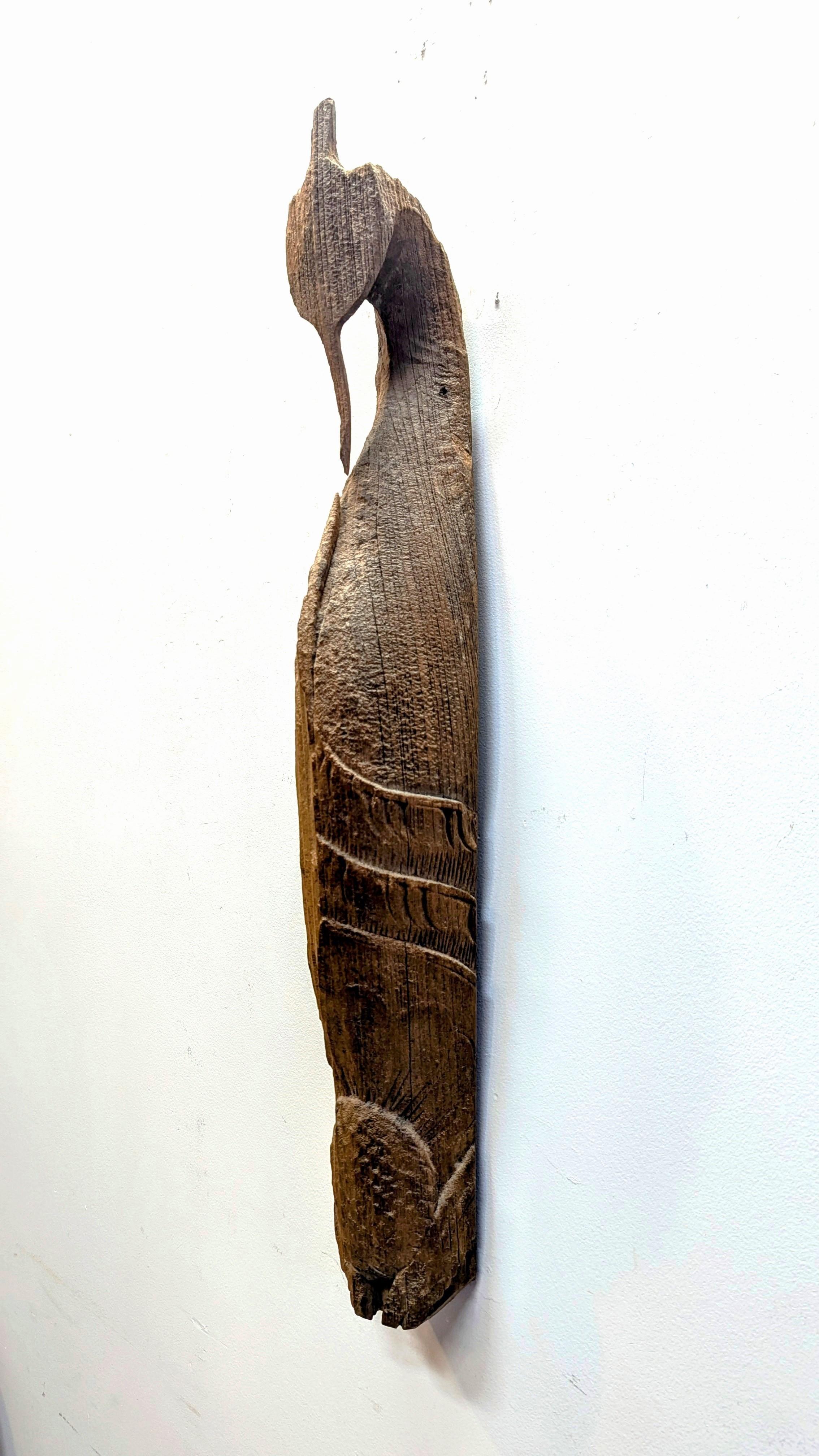 Antique Rustic Chofa Sculpture.  Solid woodblock Folk Art carving of Thai or Lao Chofa sculpture.  Carved from a sold piece of wood having a very weathered patina.  Heavy wear to the left side, some carving details still visible on the right side.  