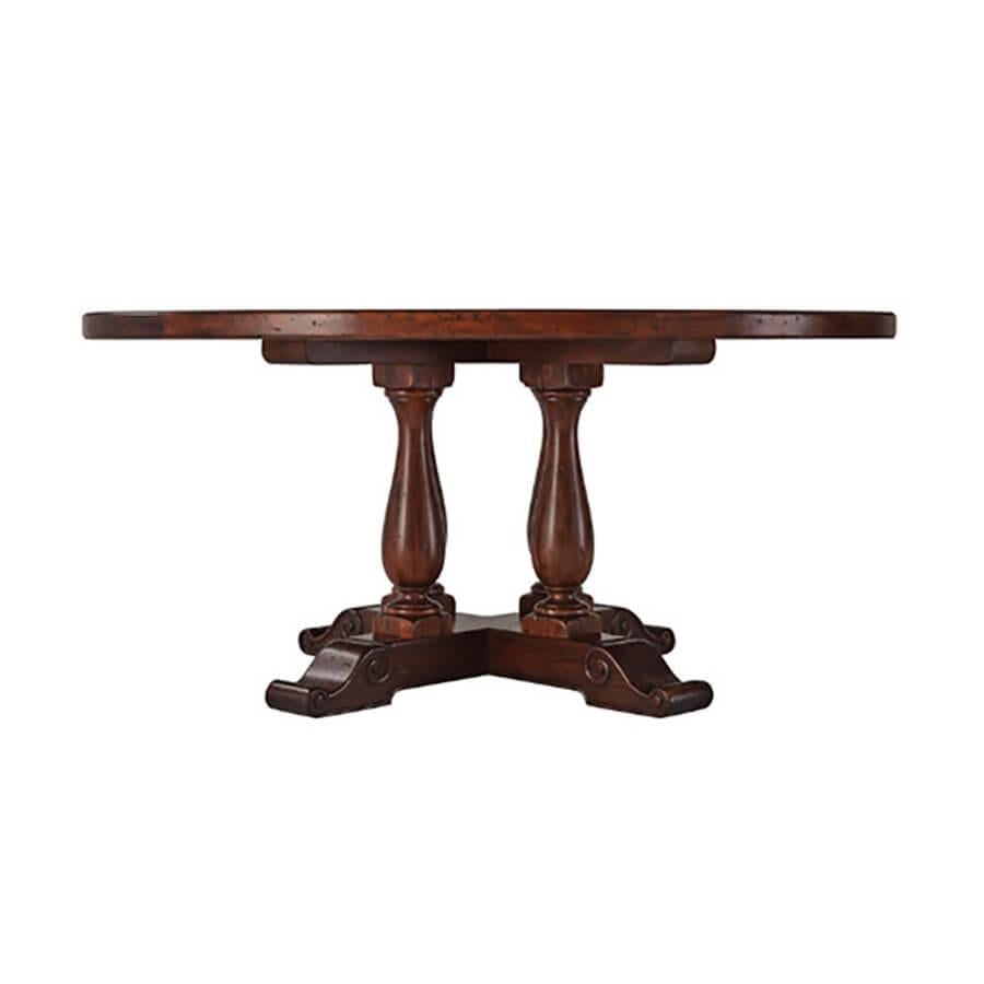 An antiqued wood circular dining or kitchen table, the top with stellar parquetry above four baluster turned supports, on an 'X' base. The original 17th century.

Dimensions: 64