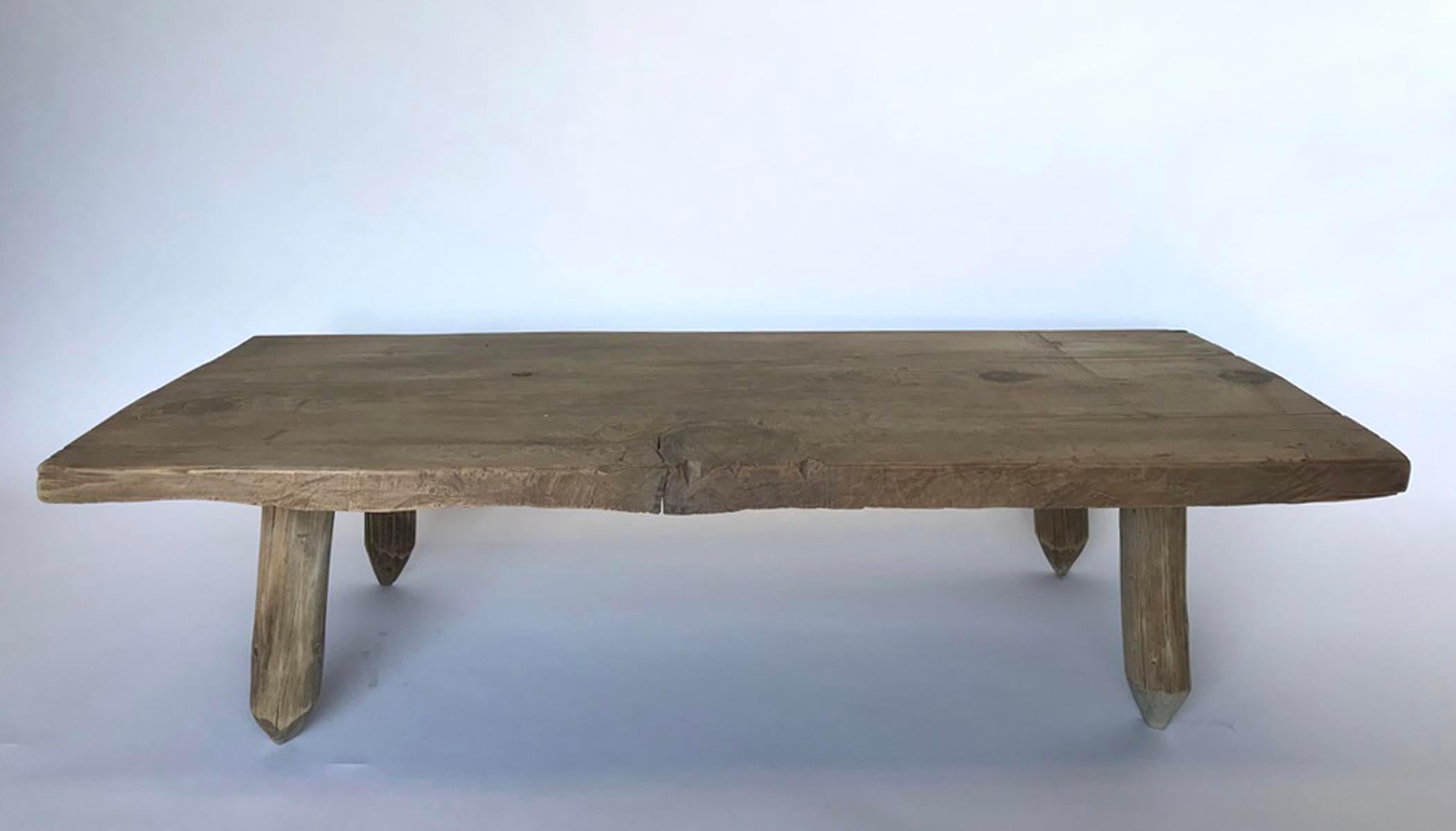 This is a match made in Los Angeles! An antique Guatemalan tropical hardwood board atop reclaimed tipi/tepee/teepee pole legs! The top and legs are completely natural, without a finish. The surface is smooth to the touch. Natural knots and cracks as