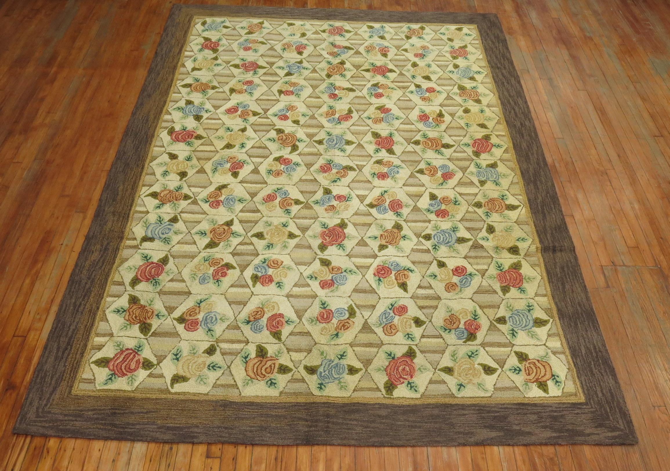 A room size mid-20th century American Hooked rug with a floral all-over design on gray khaki striped field and oatmeal brown color border. 


circa mid-20th century, measures: 8'3