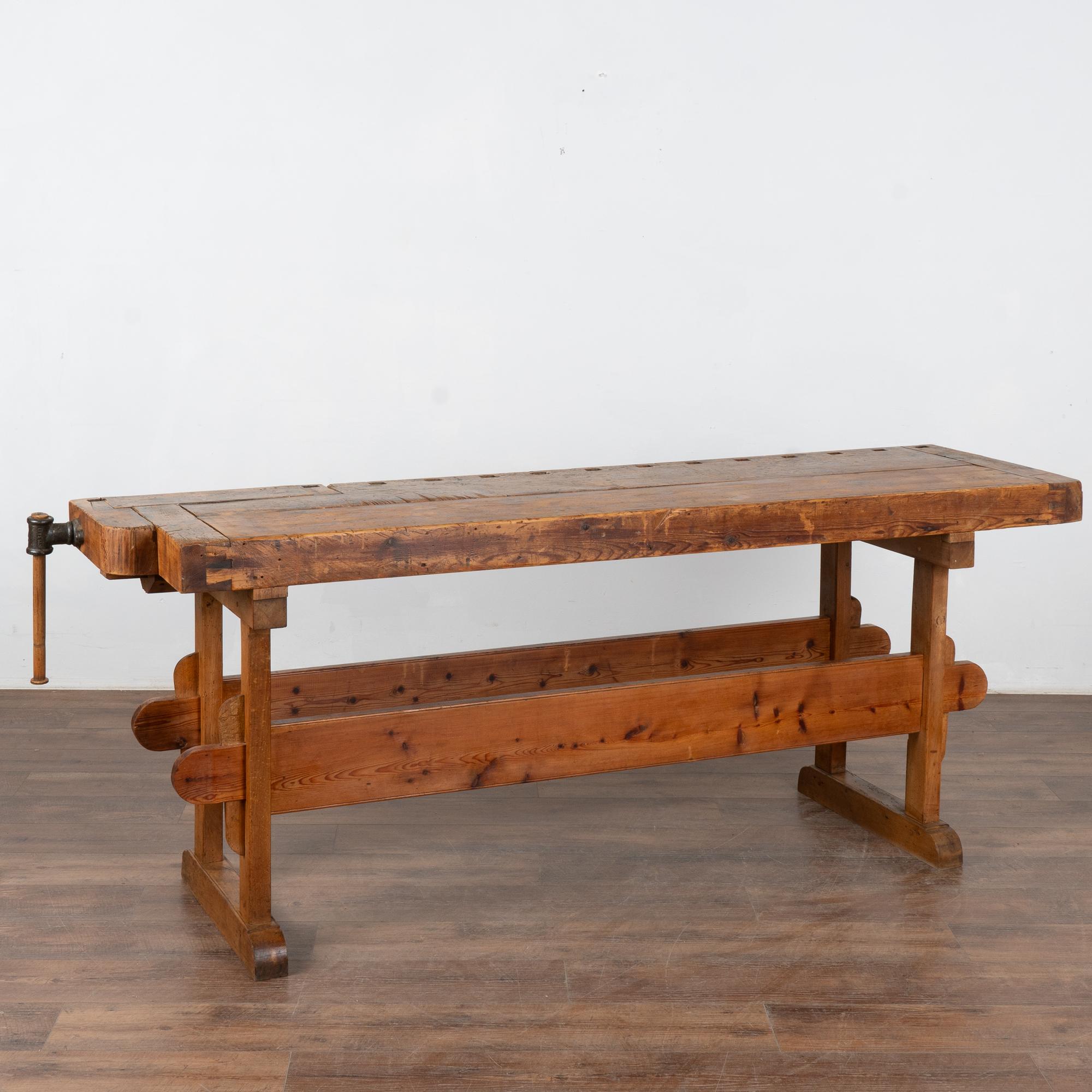 It is the years of constant use revealed in every deep gouge, ding, and scratch that enrich the character of this carpenters' workbench from Denmark.
Please examine the close up photos to appreciate the patina, joints and old hardware. 
It has one
