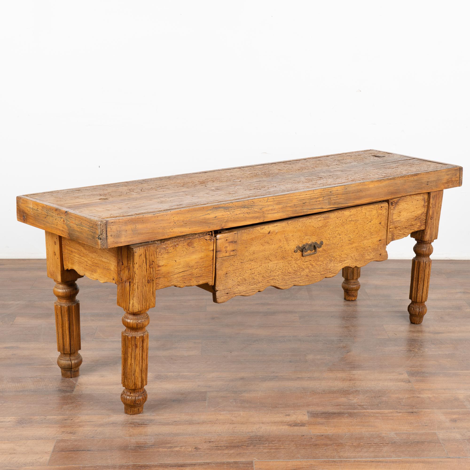 It is the incredible patina of the aged wood that creates the appeal in this French console table resting on turned legs.
The generations of use are revealed in every old knot, nick, crack, etc. all resulting in the deep patina of the 3