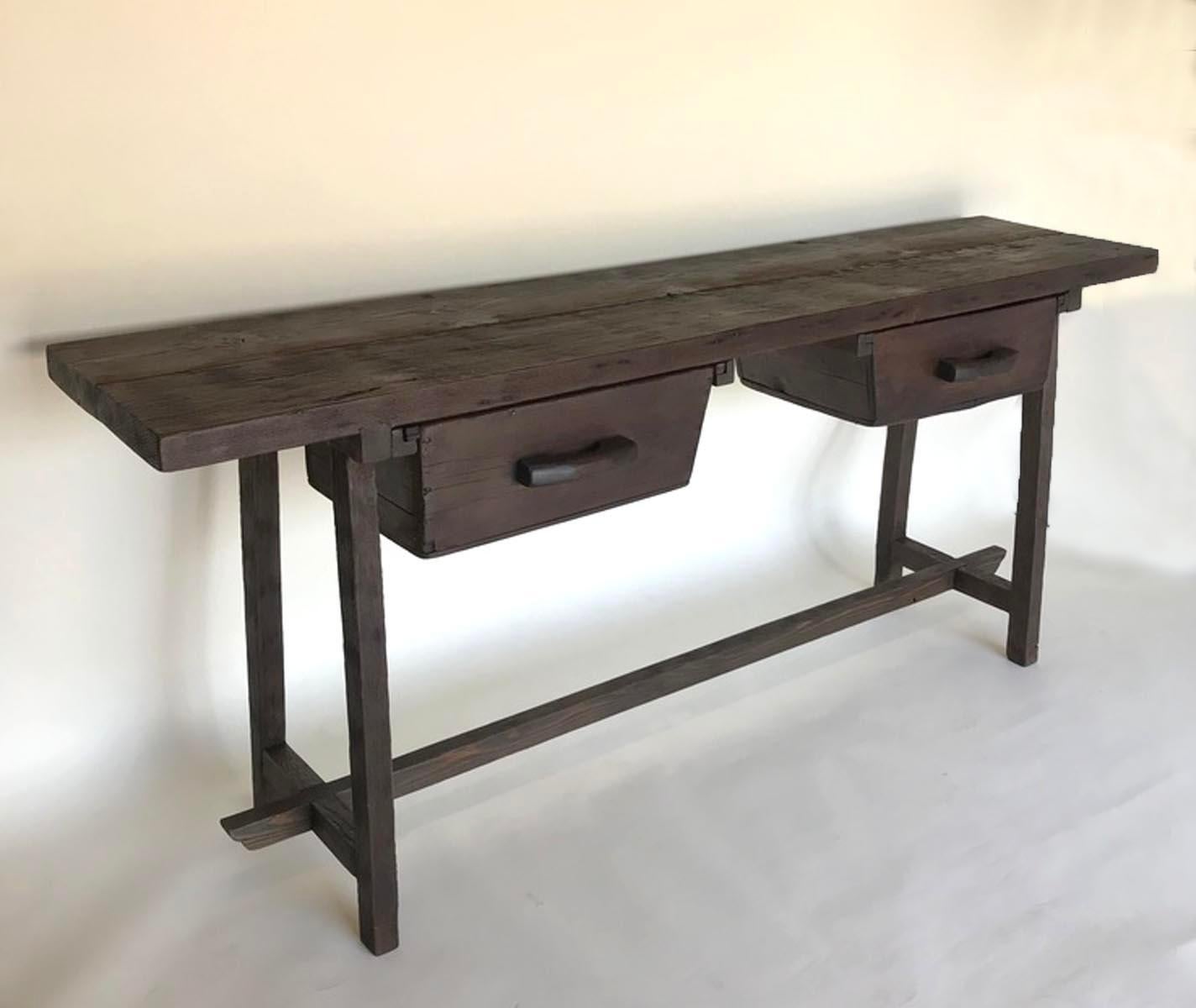 Rustic console tables made from reclaimed wood with antique Guatemalan grain measuring boxes as drawers.
Butterfly repairs in top. Sturdy and functional.