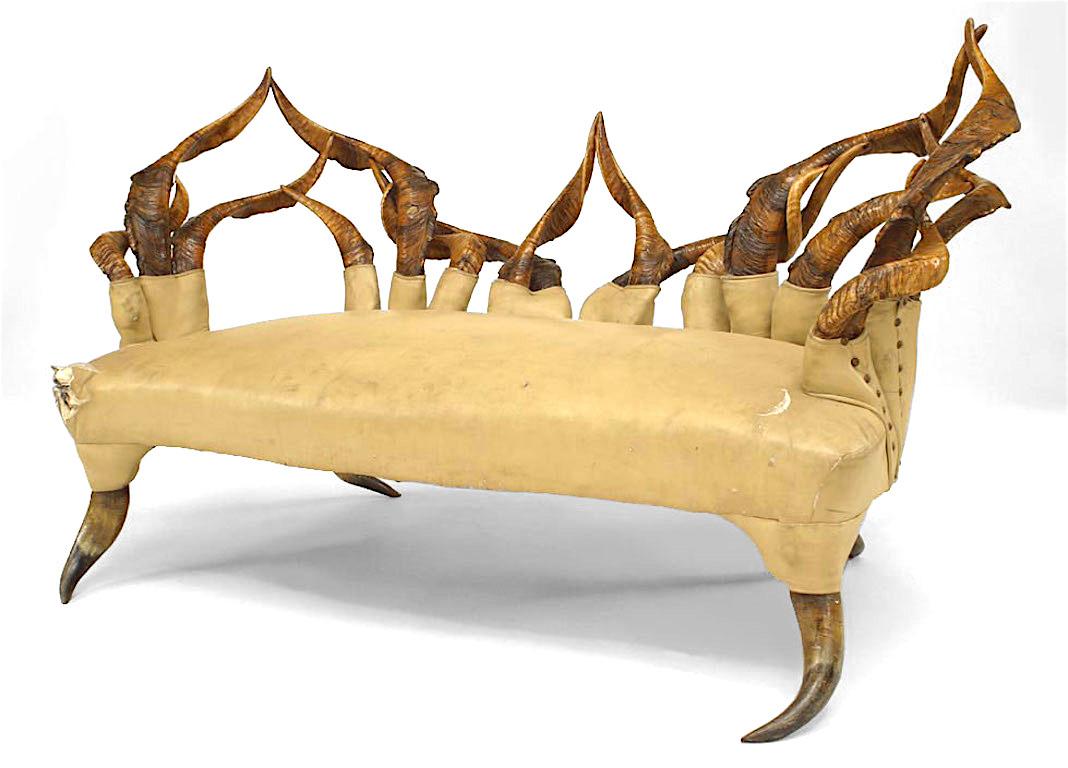 Rustic continental style (19/20th Cent) horn design open back loveseat with white leather seat
