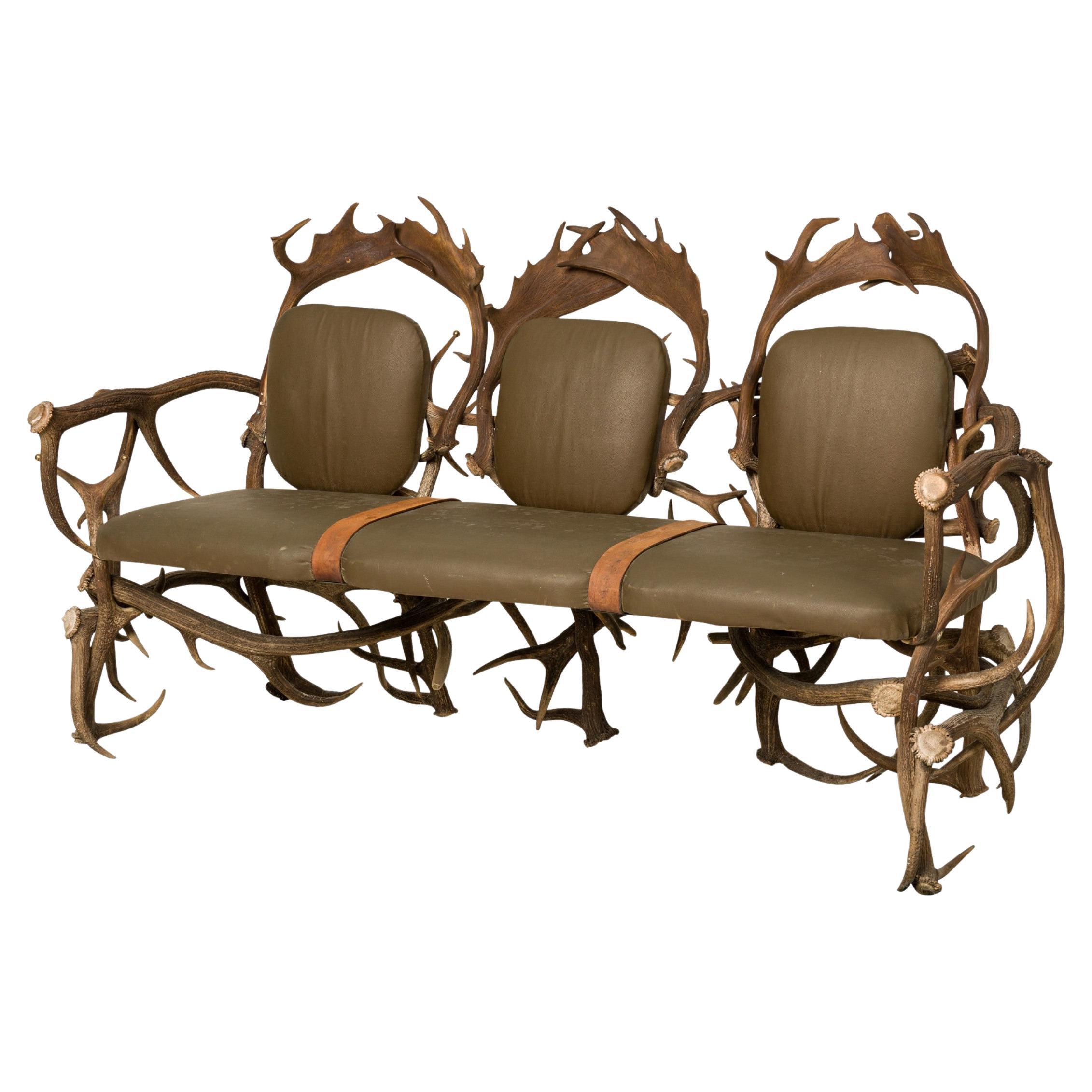 Rustic Continental Style Green Leather and Faux Antler Three-Seat Settee For Sale