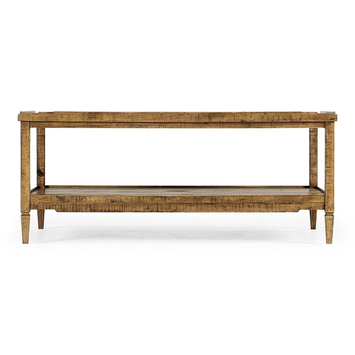 French Rustic country coffee table in a medium driftwood finish with a wooden gallery, square tapered legs and a lower tier shelf.

Dimensions: 48
