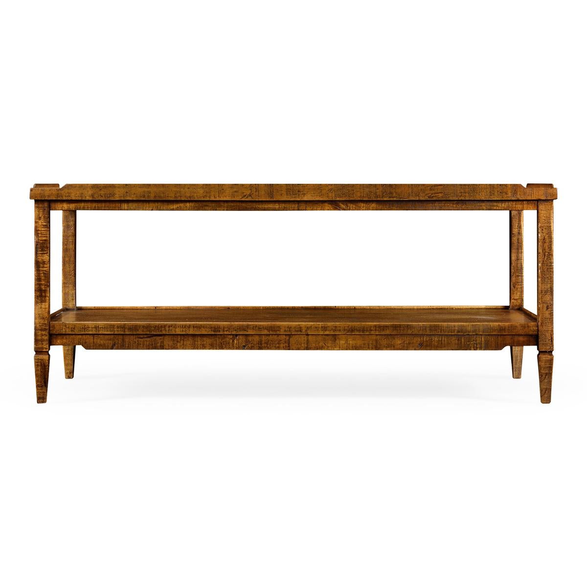 French Rustic country coffee table in a distressed walnut finish with a wooden gallery, square tapered legs and a lower tier shelf.

Dimensions: 48