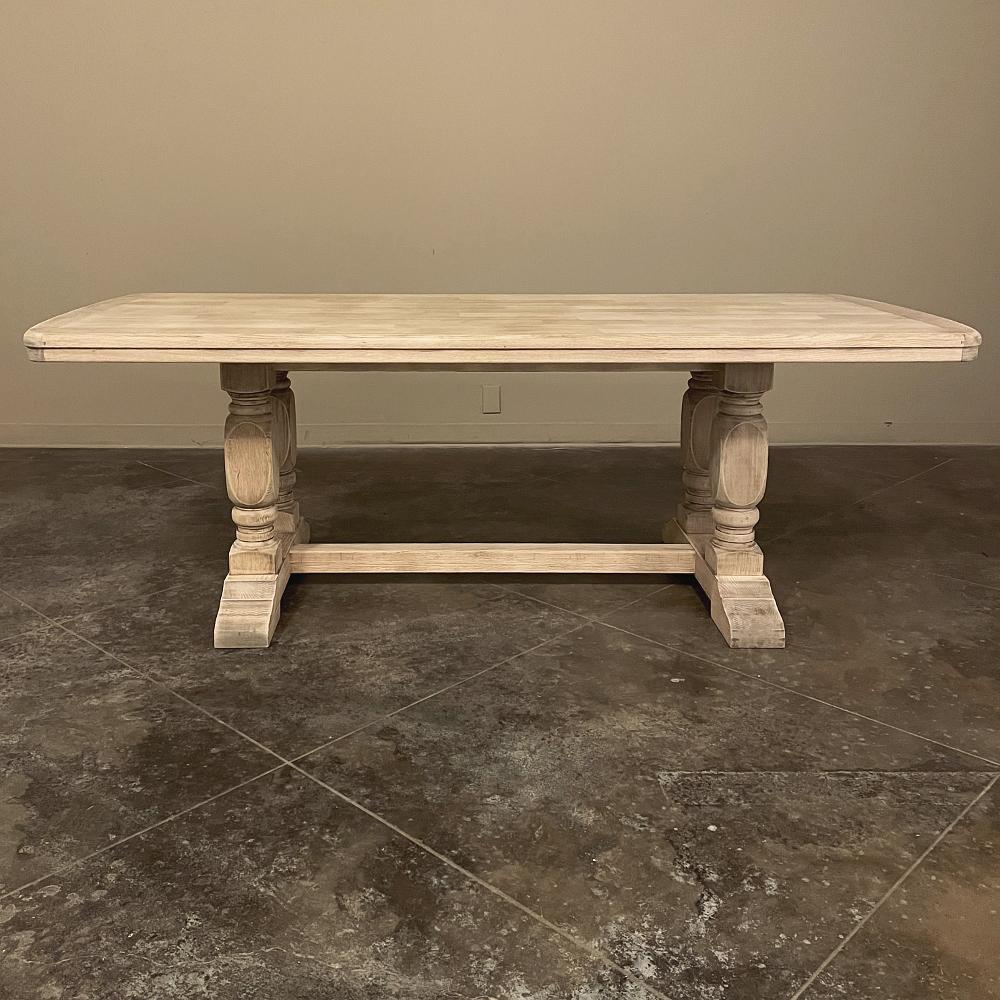 Rustic Country French Farm table in Stripped Oak was hand-crafted by talented artisans from thick planks of laminated wood to be more stable and provide decades of enjoyment for your family. The ends are wrapped in solid oak beveled and contoured to