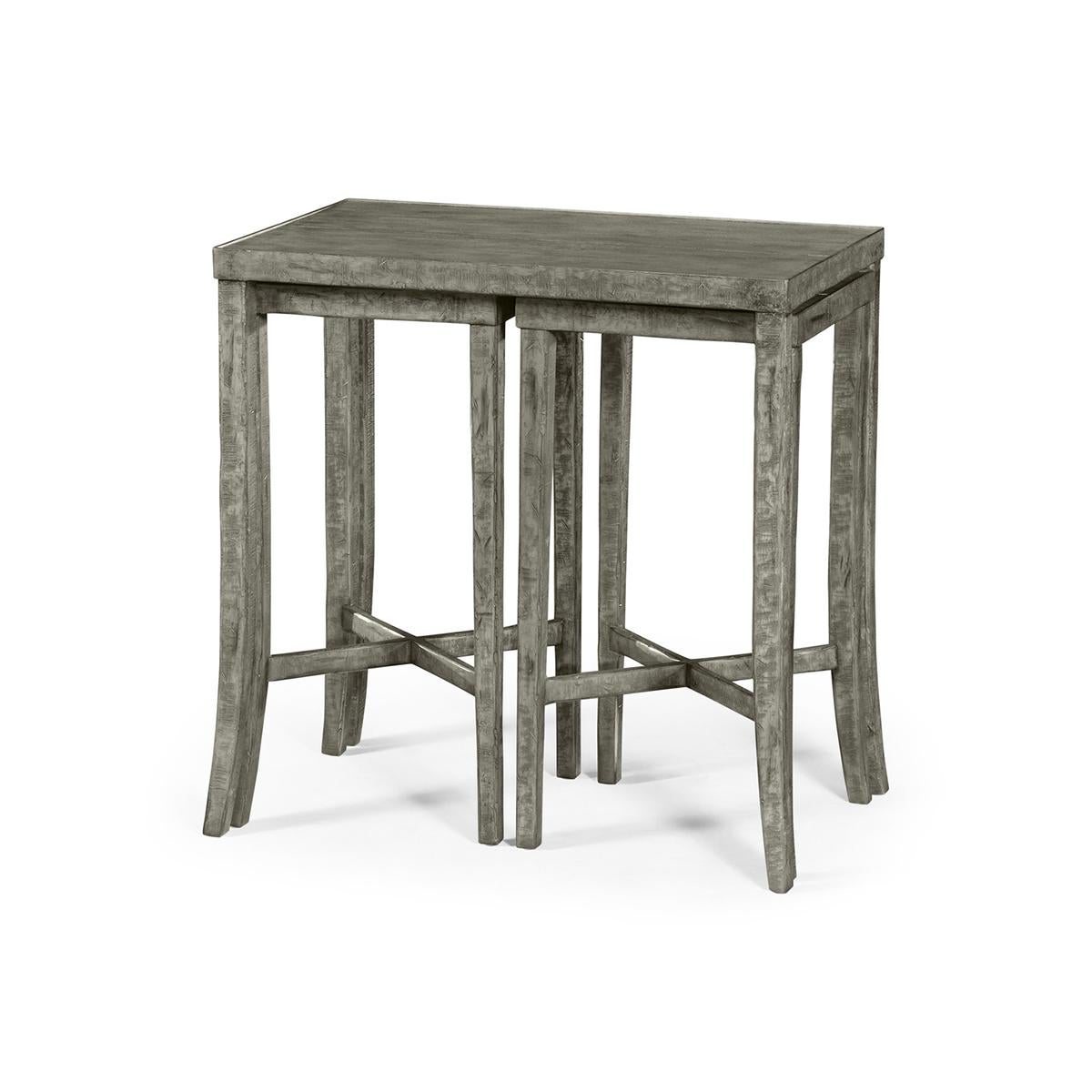 Rustic country nesting tables, these antique dark grey nesting cocktail tables feature two smaller tables that fit under the main cocktail table.

Dimensions: 28