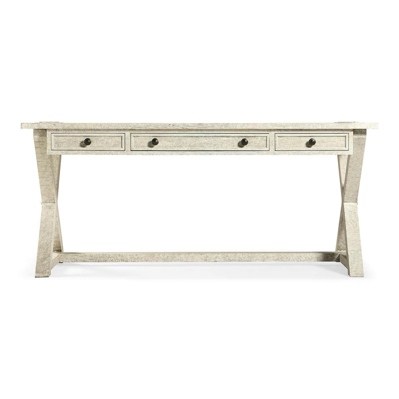 A rustic country-style solid whitewash rectangular desk with a rustic finish revealing exposed saw marks. Three small oak-lined drawers to front with mortice and tenon joints to X-frame support and top surface.

Dimensions: 68