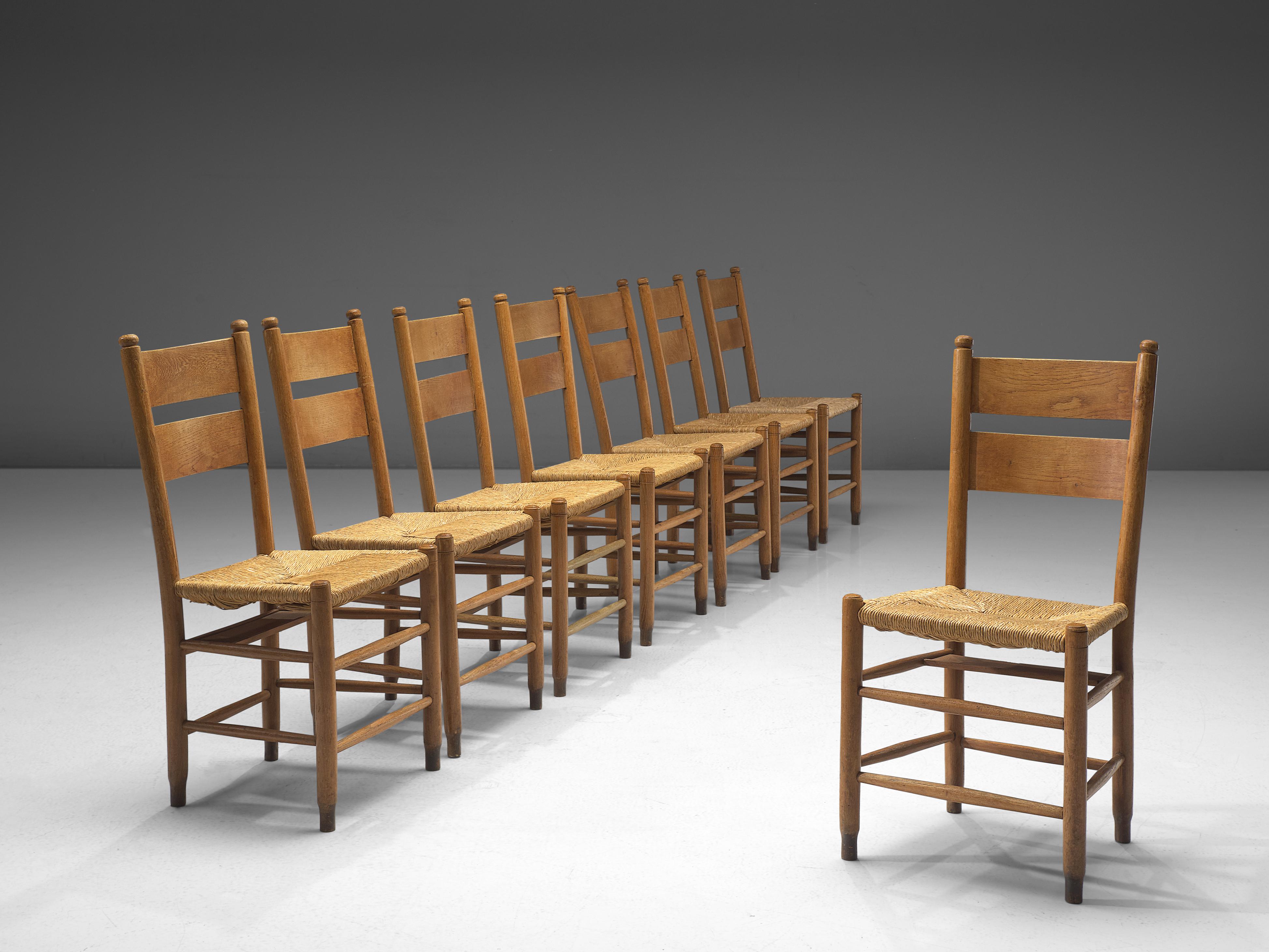 Danish church chairs, oak and rush seating, Denmark, 1960s.

Rustic Danish church chairs made in oak and with a rush seat. The chairs features subtle details, such as the double backrest and double slats below the seat. Please note we have a very