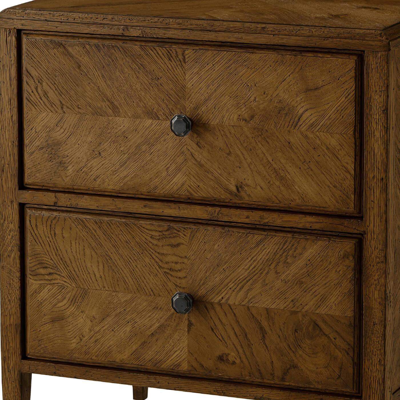 With a herringbone parquetry design. This beautiful nightstand has two frieze-inspired drawers with Verde Bronze handles. It is supported by two-tier stretcher shelves. 
Shown in Dusk Finish
Dimensions: 24