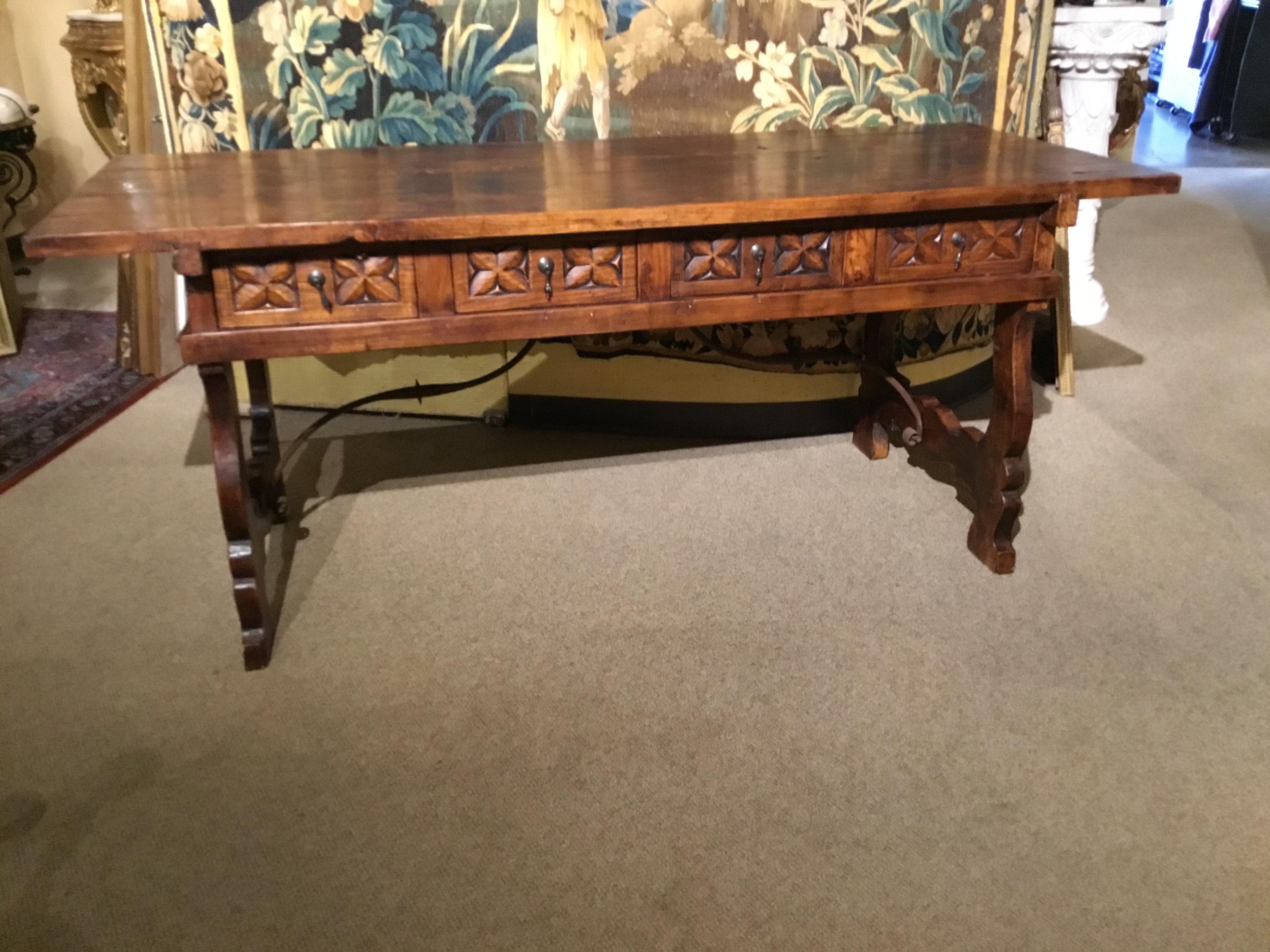 Handsome and rugged look with re-claimed wood. Dark finish with iron
Stretcher. This piece has four workable drawers. It is very sturdy without
Any problems.