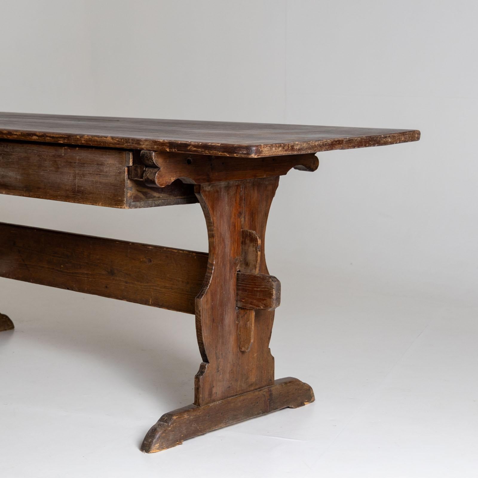 Stained Rustic dining table with one drawer, 19th Century For Sale