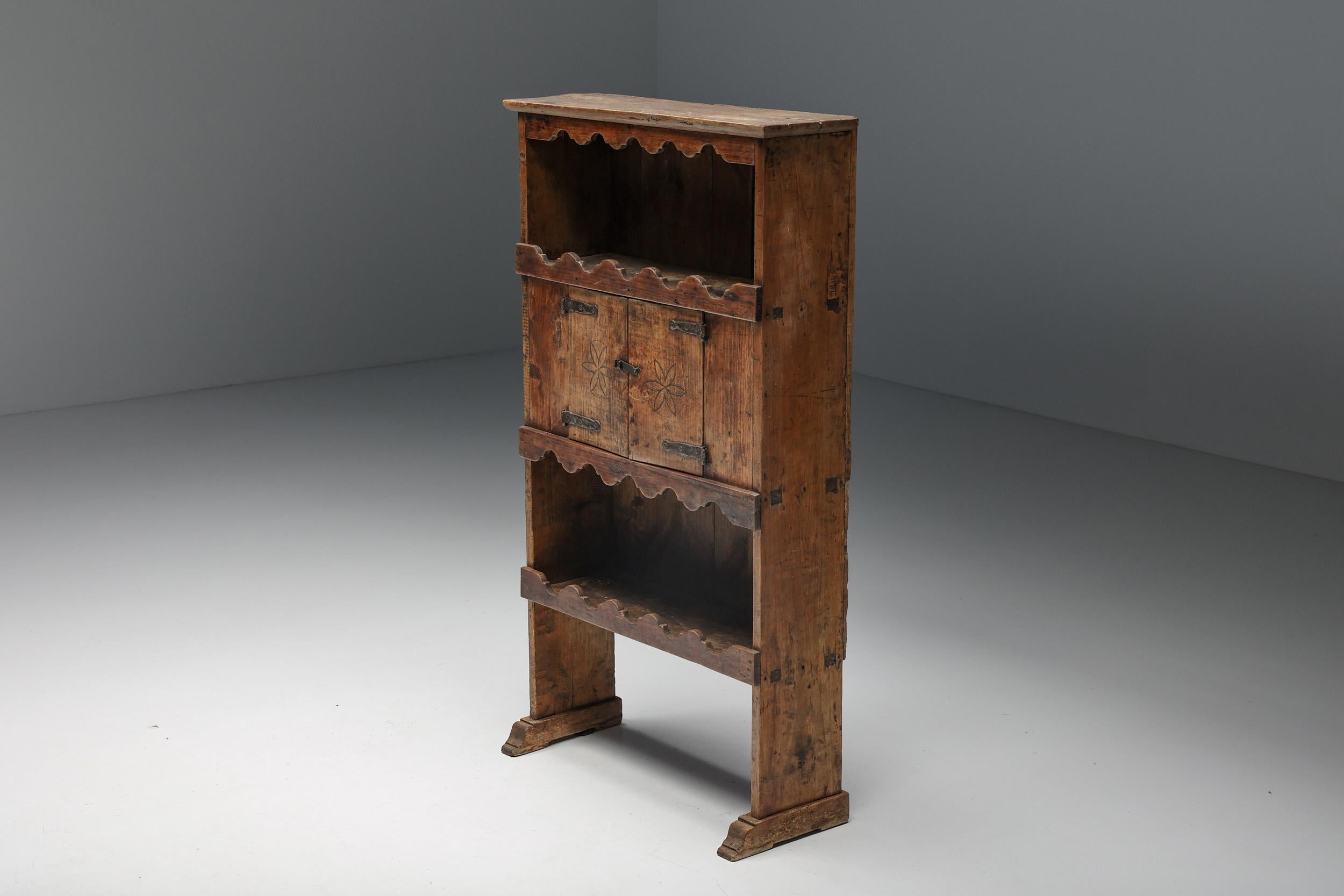 Rustic; Dressoir; Rural; Wabi-Sabi; flower pattern; cabinet; doors; 19th Century; French Craftsmanship; France;

This rustic dressoir has three shelves of which one is covered by two doors with a floral pattern. It's an ideal storage item to