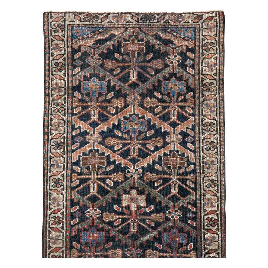 An antique Persian Kurd rug in runner format handmade during the early 20th century with a rustic appeal.

Measures: 1' 10