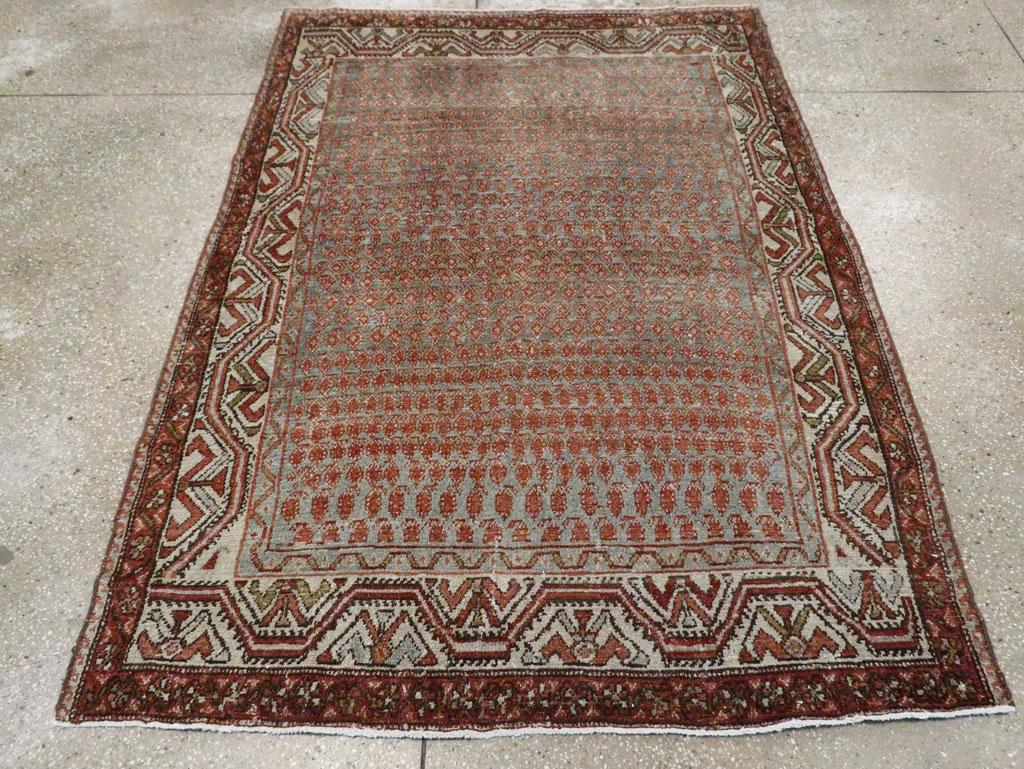 An antique Persian Malayer accent rug handmade during the early 20th century.

Measures: 4' 6