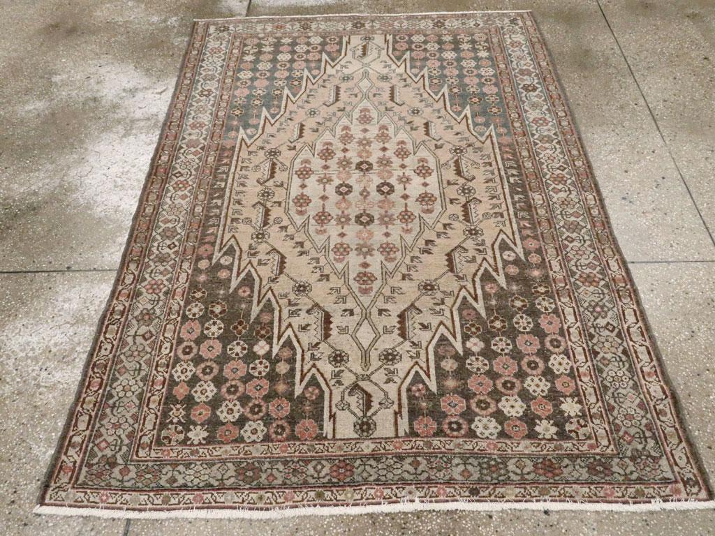 An antique Persian Mazlagan Malayer accent rug handmade during the early 20th century.

Measures: 4' 6