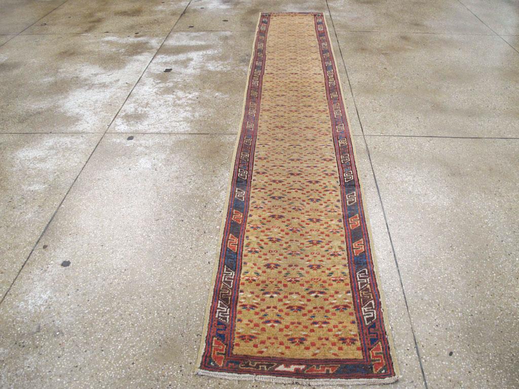An antique Persian Serab rug in runner format with a rustic appeal handmade during the early 20th century.

Measures: 2' 1