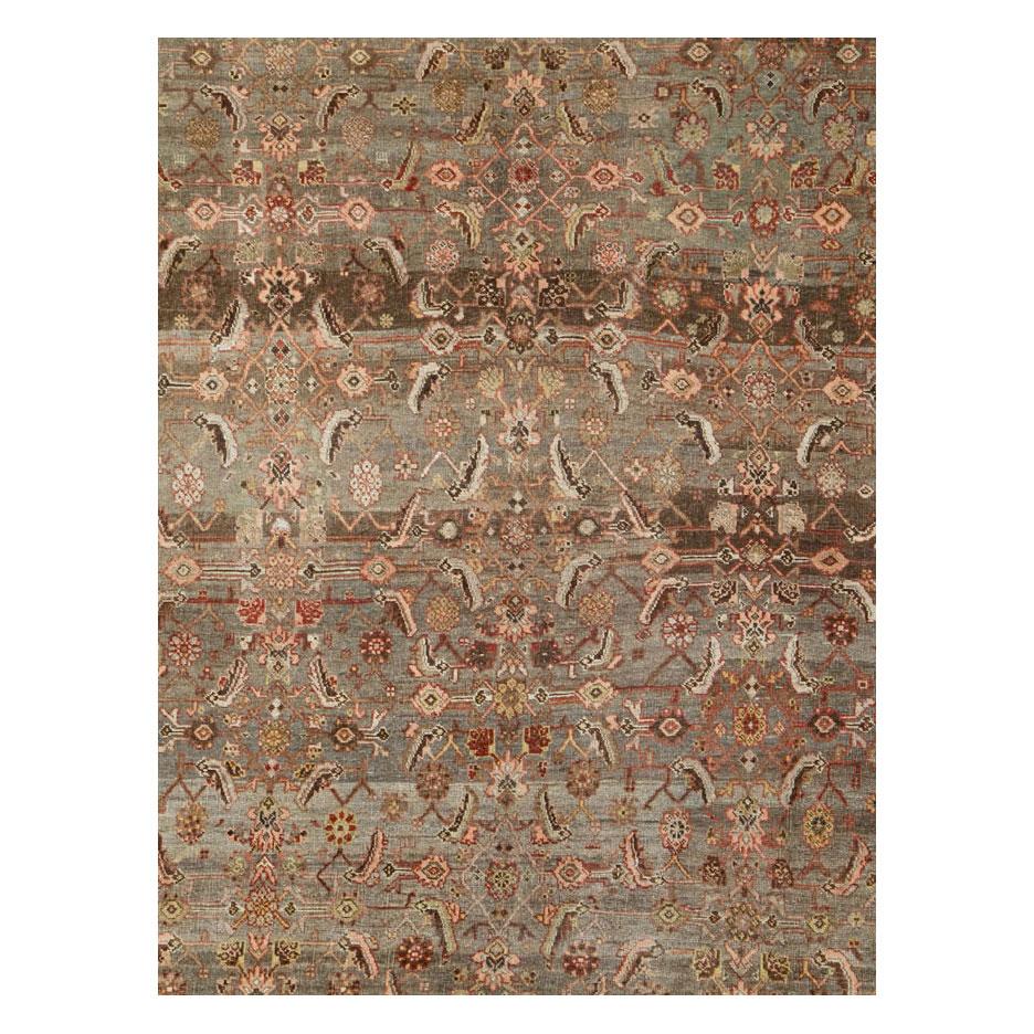 An antique Persian Bidjar room size carpet handmade during the early 20th with an overall rustic aesthetic in earth tones.

Measures: 9' 4