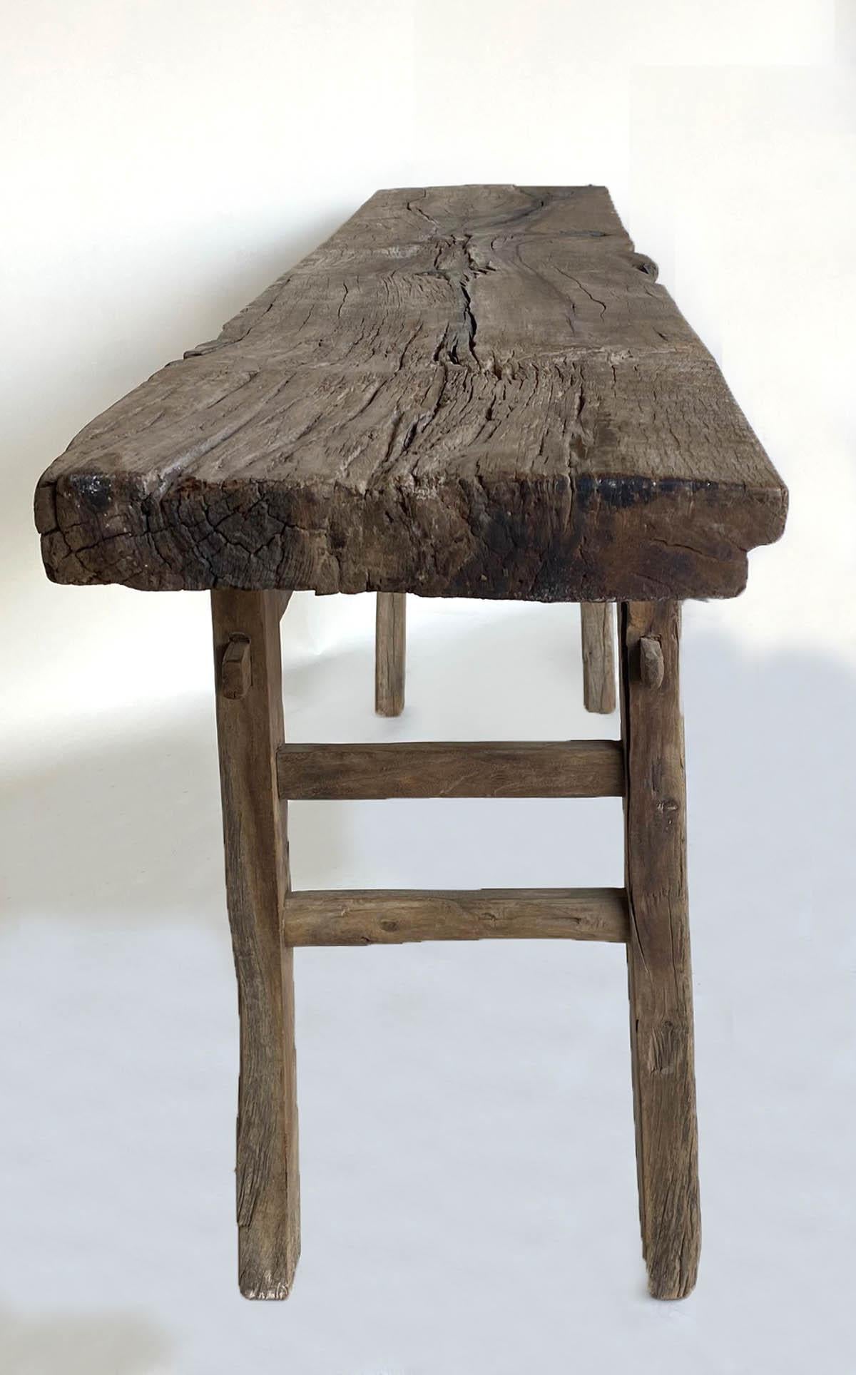 Antique rustic Chinese elm altar table. Mortise and Tenon construction. Double side stretchers. One wide board top with weathered patina. Very smooth to the touch.
   