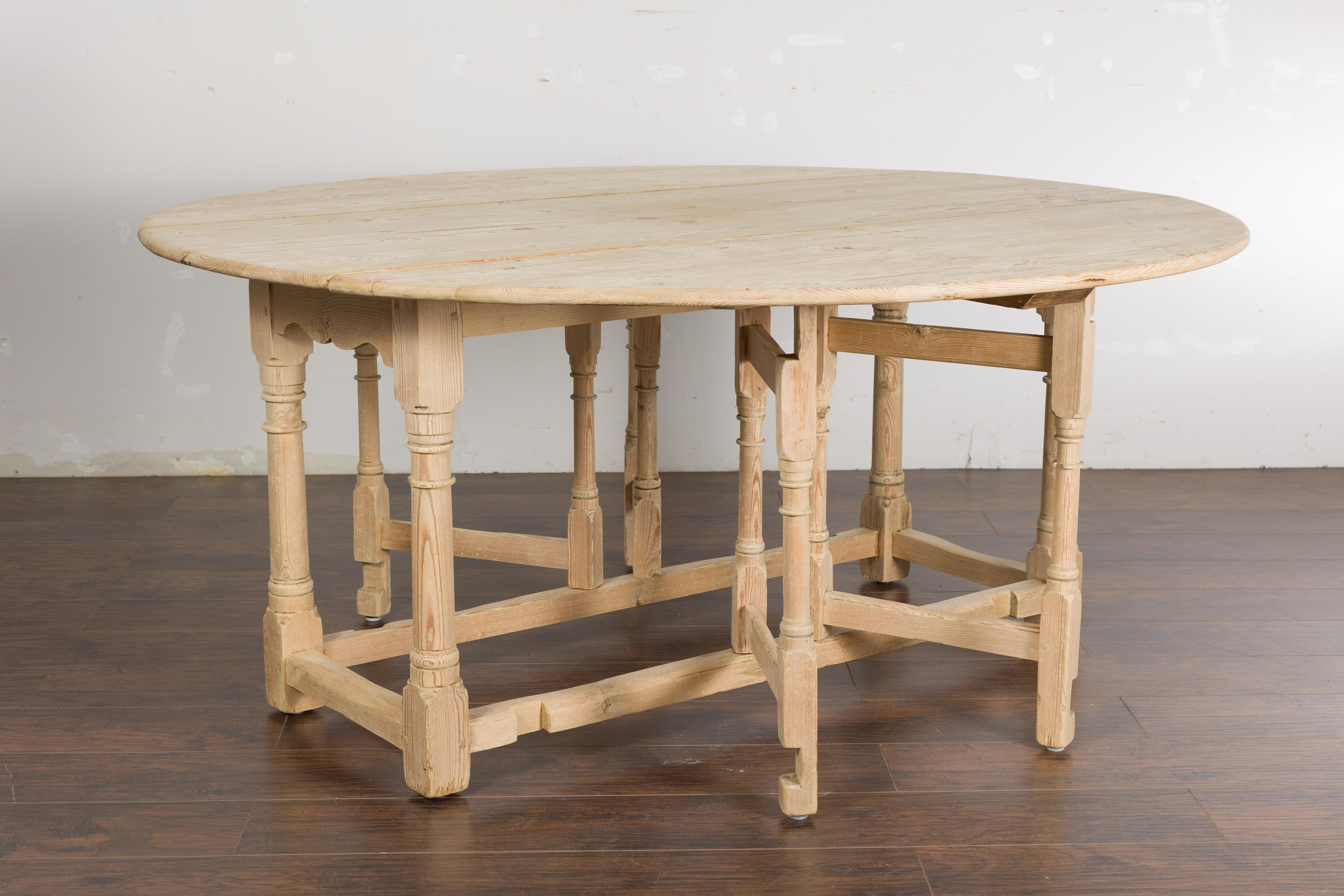 Rustic English 19th Century Pine Drop Leaf Round Top Table with Turned Legs For Sale 9