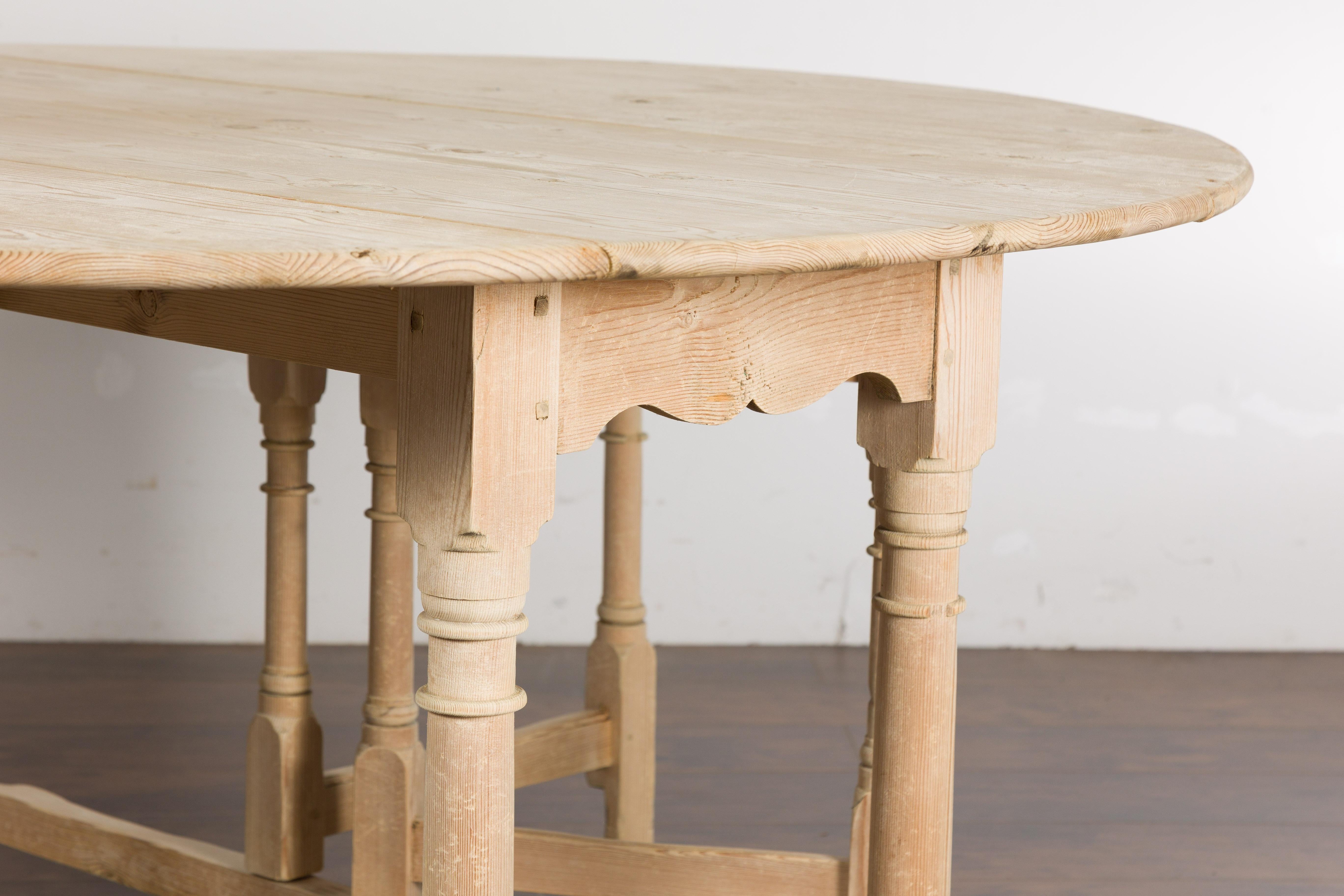 Rustic English 19th Century Pine Drop Leaf Round Top Table with Turned Legs For Sale 12