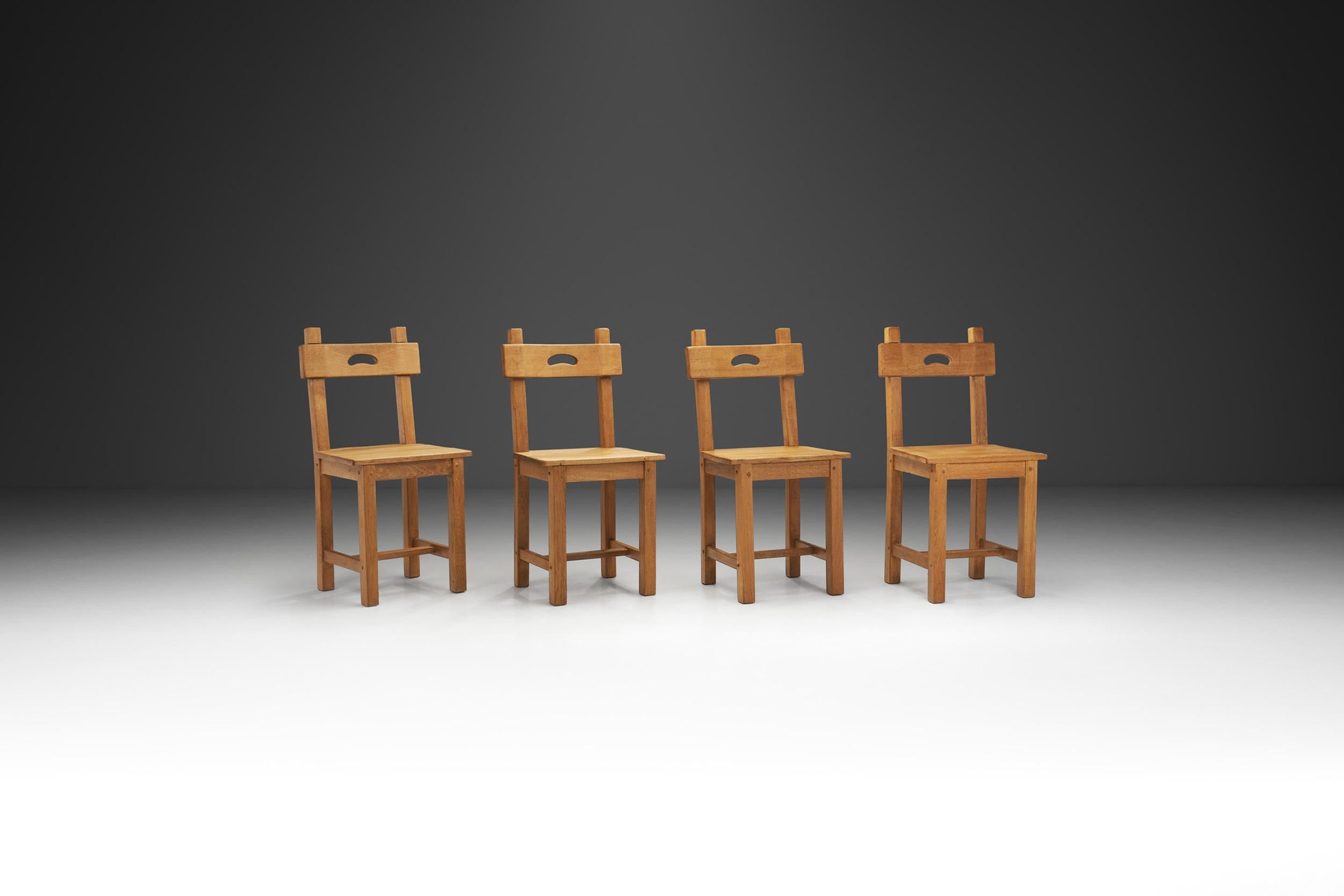 Mid-20th Century Rustic European Cabinetmaker Oak Dining Chairs, Europe ca 1950s For Sale