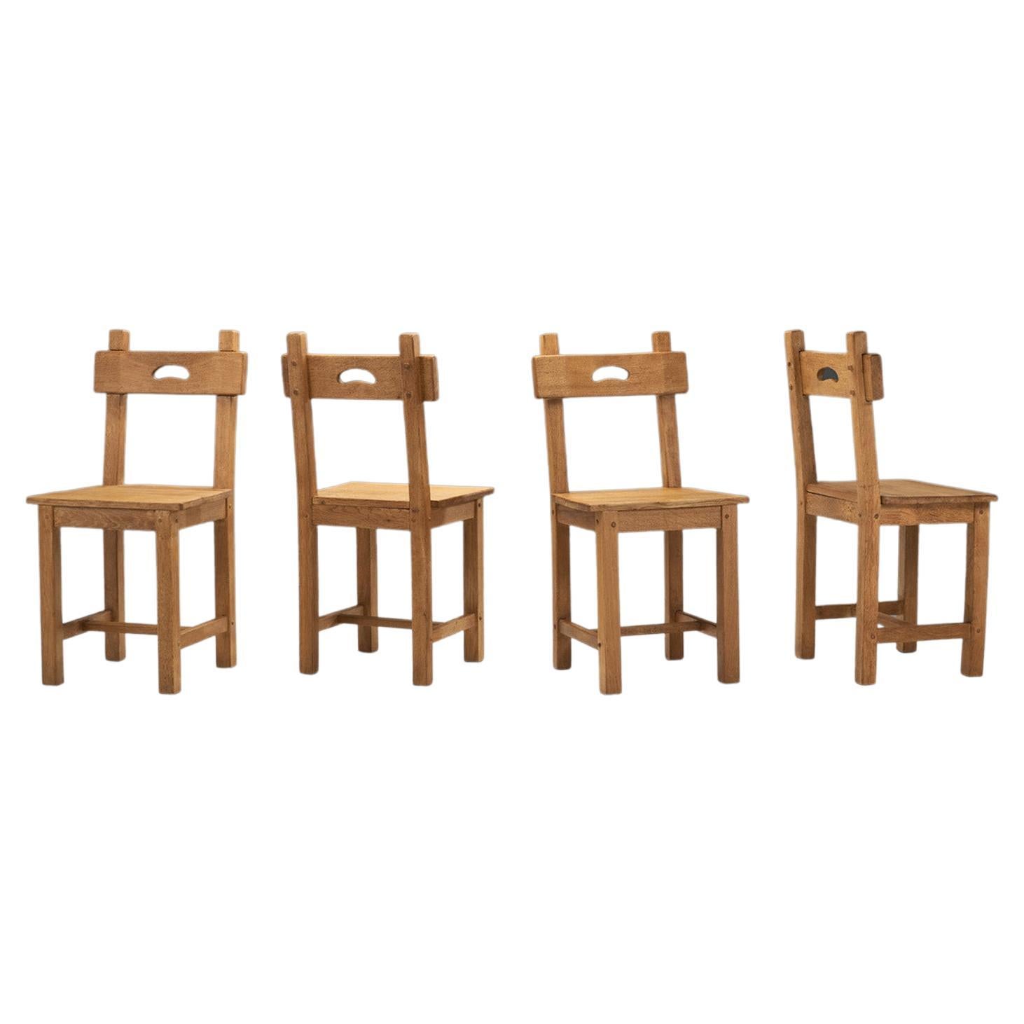 Rustic European Cabinetmaker Oak Dining Chairs, Europe ca 1950s For Sale